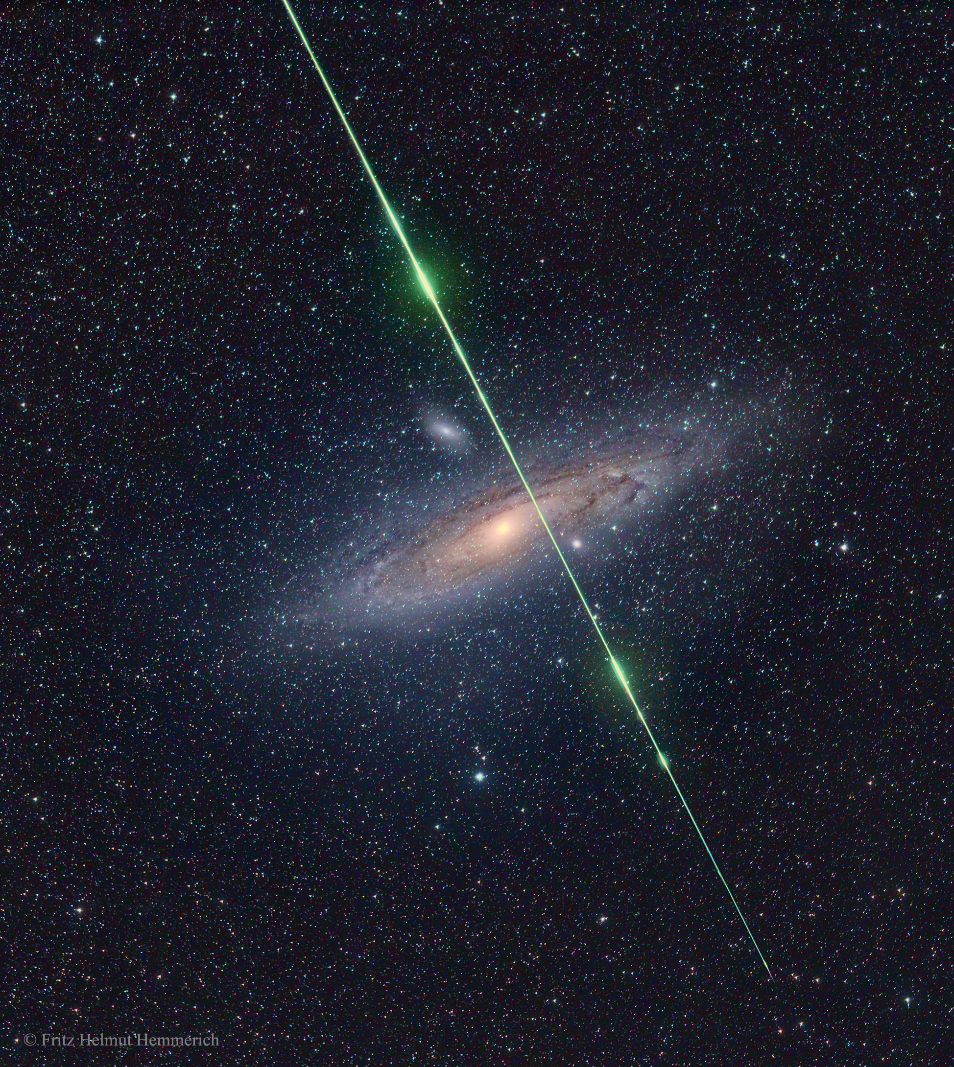 What's that green streak in front of the Andromeda galaxy? A meteor. While photographing the Andromeda galaxy in 2016, near the peak of the Perseid Meteor Shower, a sand-sized rock from deep space crossed right in front of our Milky Way Galaxy's far-distant companion. The small meteor took only a fraction of a second to pass through this 10-degree field.  The meteor flared several times while braking violently upon entering Earth's atmosphere.  The green color was created, at least in part, by the meteor's gas glowing as it vaporized. Although the exposure was timed to catch a Perseids meteor, the orientation of the imaged streak seems a better match to a meteor from the Southern Delta Aquariids, a meteor shower that peaked a few weeks earlier.  Not coincidentally, the Perseid Meteor Shower peaks again tonight.    Gallery: NASA Launch of the Parker Solar Probe