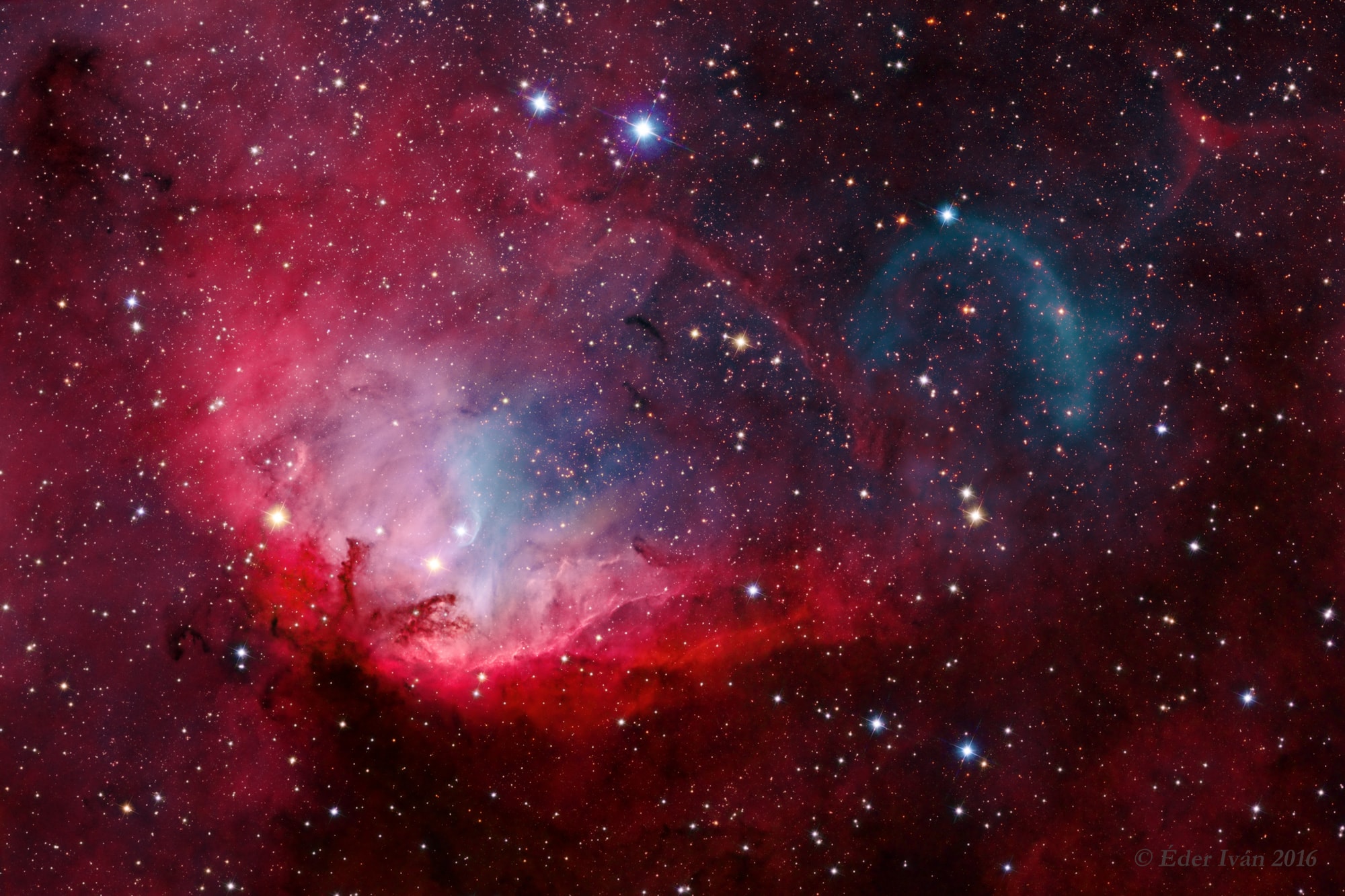 Framing a bright emission region, this telescopic view looks out along the plane of our Milky Way Galaxy toward the nebula rich constellation Cygnus the Swan. Popularly called the Tulip Nebula, the reddish glowing cloud of interstellar gas and dust is also found in the 1959 catalog by astronomer Stewart Sharpless as Sh2-101. About 8,000 light-years distant and 70 light-years across the complex and beautiful nebula blossoms at the center of this composite image. Ultraviolet radiation from young energetic stars at the edge of the Cygnus OB3 association, including O star HDE 227018, ionizes the atoms and powers the emission from the Tulip Nebula. HDE 227018 is the bright star near the center of the nebula. Also framed in the field of view is microquasar Cygnus X-1, one of the strongest X-ray sources in planet Earth's sky. Driven by powerful jets from a black hole accretion disk, its fainter visible curved shock front lies above and right, just beyond the cosmic Tulip's petals