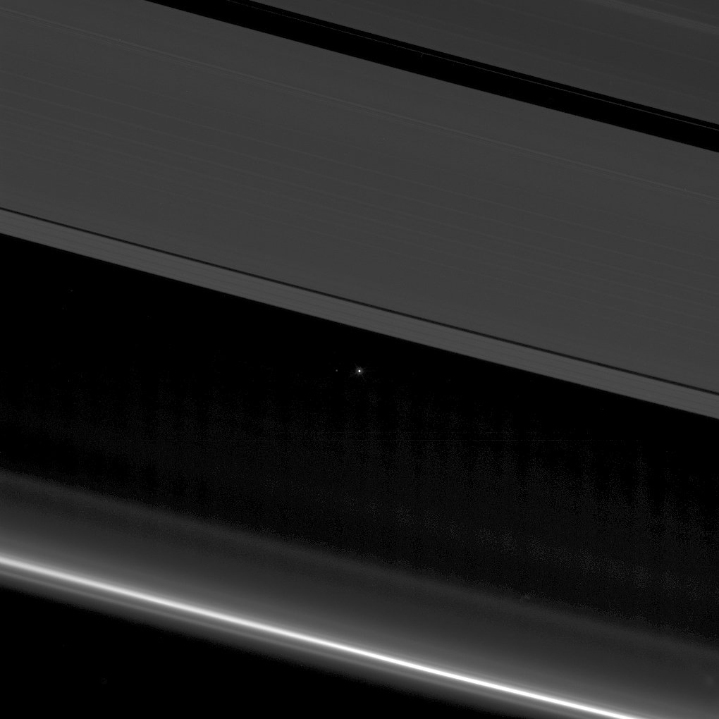 On April 12, as the Sun was blocked by the disk of Saturn the Cassini spacecraft camera looked toward the inner Solar System and the gas giant's backlit rings. At the top of the mosaicked view is the A ring with its broader Encke and narrower Keeler gaps visible. At the bottom is the F ring, bright due to the viewing geometry.  The point of light between the rings is Earth, 1.4 billion kilometers in the distance. Look carefully and you can even spot Earth's large moon, a pinprick of light to the planet's left. Today Cassini makes its final close approach to Saturn's own large moon Titan, using Titan's gravity to swing into the spacecraft's Grand Finale, the final set of orbits that will bring Cassini just inside Saturn's rings.  Celebrate Earth Day: Adopt the Planet