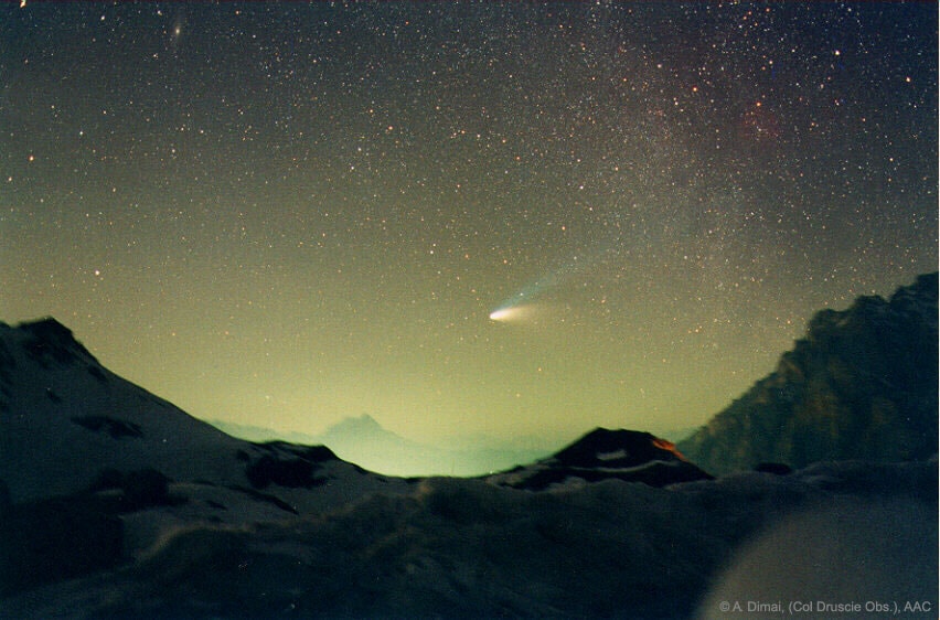 Comet Hale-Bopp, the Great Comet of 1997, became much brighter than any surrounding stars. It was seen even over bright city lights. Away from city lights, however, it put on quite a spectacular show. Here Comet Hale-Bopp was photographed above Val Parola Pass in the Dolomite mountains surrounding Cortina d'Ampezzo, Italy. Comet Hale-Bopp's blue ion tail, consisting of ions from the comet's nucleus, is pushed out by the solar wind. The white dust tail is composed of larger particles of dust from the nucleus driven by the pressure of sunlight, that orbit behind the comet. Comet Hale-Bopp (C/1995 O1) remained visible to the unaided eye for 18 months -- longer than any other comet in recorded history. This year marks the 20th anniversary of Comet Hale-Bopp's last trip to the inner Solar System.  The large comet is next expected to return around the year 4385.