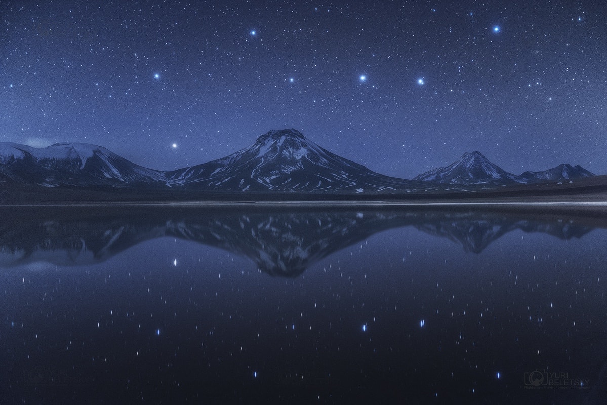 Do you see it?  This common question frequently precedes the rediscovery of one of the most commonly recognized configurations of stars on the northern sky: the Big Dipper.  This grouping of stars is one of the few things that has likely been seen, and will be seen, by every generation.   The Big Dipper is not by itself a constellation.  Although part of the constellation of the Great Bear (Ursa Major), the Big Dipper is an asterism that has been known by different names to different societies. Five of the Big Dipper stars are actually near each other in space and were likely formed at nearly the same time.  Connecting two stars in the far part of the Big Dipper will lead one to Polaris, the North Star, which is part of the Little Dipper.   Relative stellar motions will cause the Big Dipper to slowly change its configuration over the next 100,000 years. Pictured in late April, the Big Dipper was actually imaged twice -- above and below distant Chilean volcanoes, the later reflected from an unusually calm lagoon.    Follow APOD on: Facebook,  Google Plus,  Instagram, or Twitter