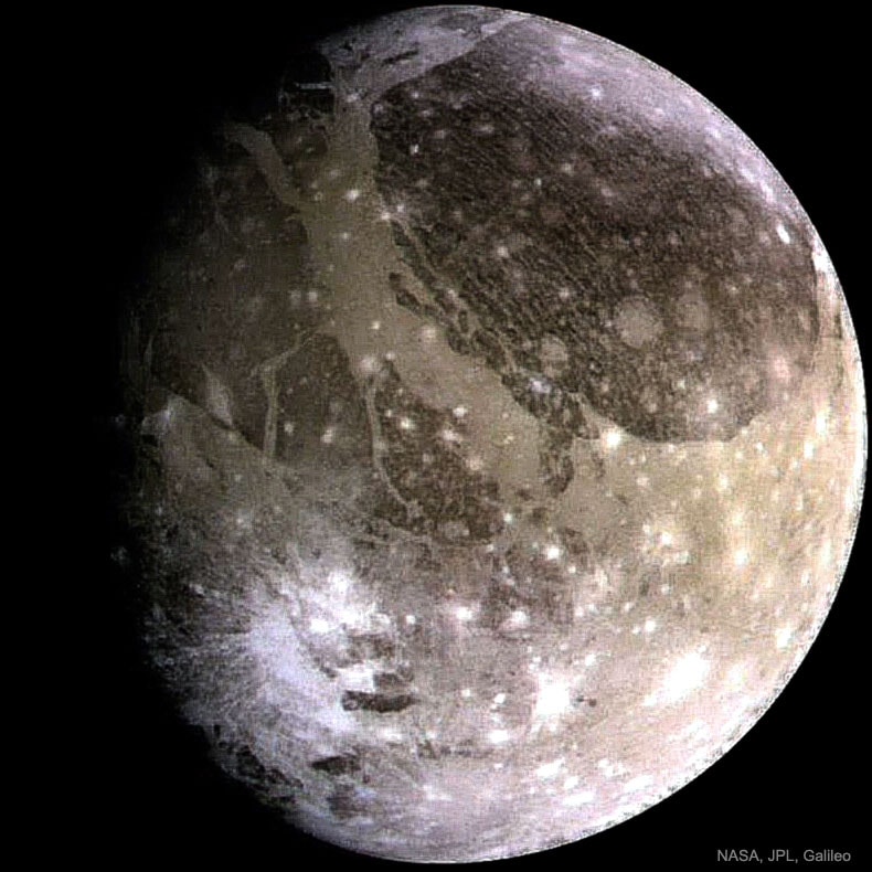 What does the largest moon in the Solar System look like?  Jupiter's moon Ganymede, larger than even Mercury and Pluto, has an icy surface speckled with bright young craters overlying a mixture of older, darker, more cratered terrain laced with grooves and ridges.  The large circular feature on the upper right, called Galileo Regio, is an ancient region of unknown origin. Ganymede is thought to have an ocean layer that contains more water than Earth and might contain life. Like Earth's Moon, Ganymede keeps the same face towards its central planet, in this case Jupiter. The featured image was taken about 20 years ago by NASA's Galileo probe, which ended its mission by diving into Jupiter's atmosphere in 2003. Currently, NASA's Juno spacecraft orbits Jupiter and is studying the giant planet's internal structure, among many other attributes.