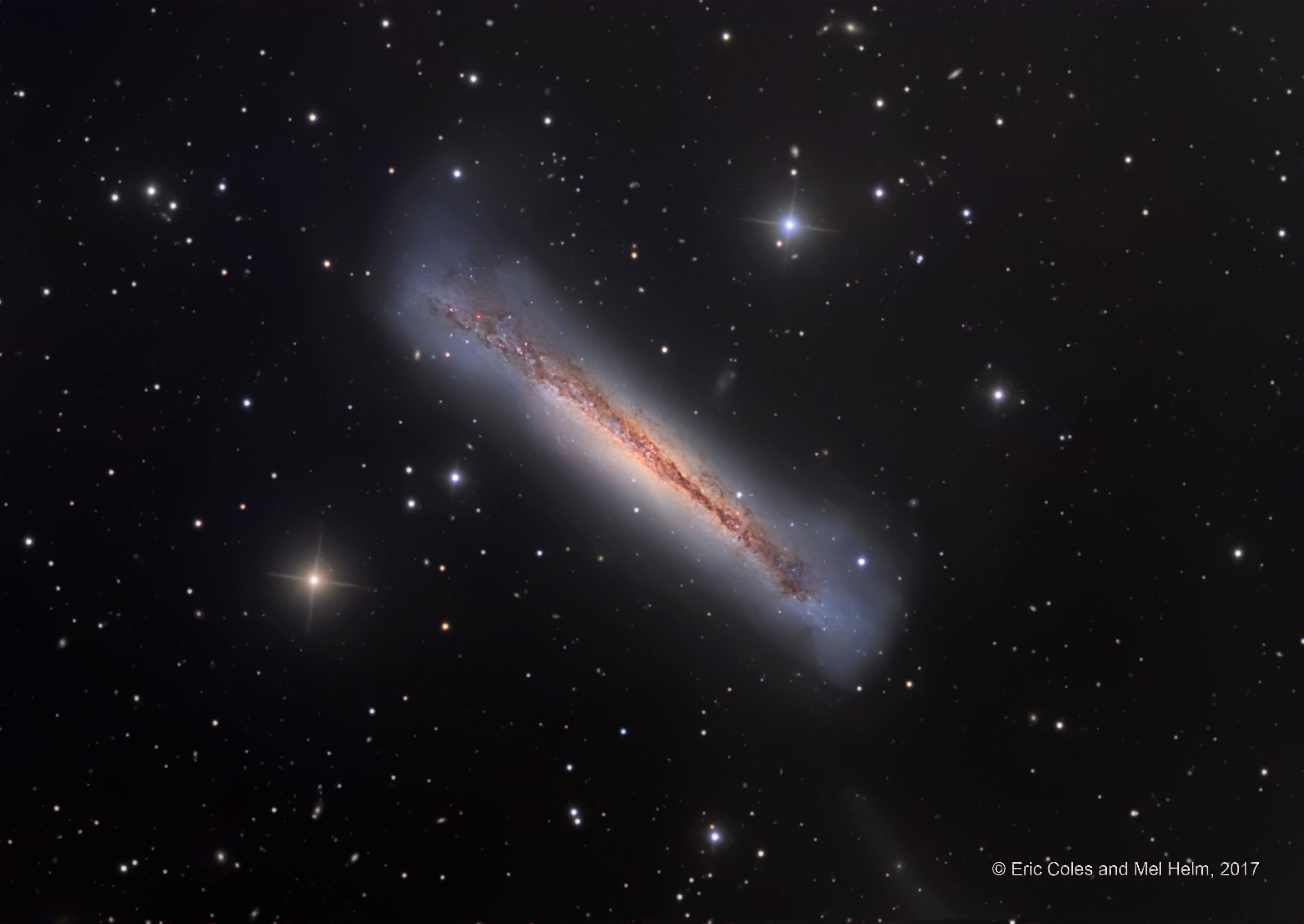 No, hamburgers are not this big. What is pictured is a sharp telescopic view of a magnificent edge-on spiral galaxy NGC 3628, a puffy galactic disk divided by dark dust lanes. Of course, this deep galactic portrait puts some astronomers in mind of its popular moniker, The Hamburger Galaxy. The tantalizing island universe is about 100,000 light-years across and 35 million light-years away in the northern springtime constellation Leo. NGC 3628 shares its neighborhood in the local Universe with two other large spirals M65 and M66 in a grouping otherwise known as the Leo Triplet. Gravitational interactions with its cosmic neighbors are likely responsible for the extended flare and warp of this spiral's disk.