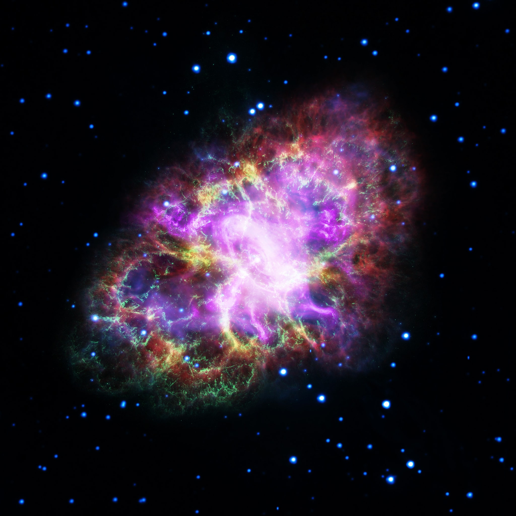 The Crab Nebula is cataloged as M1, the first object on Charles Messier's famous list of things which are not comets. In fact, the Crab is now known to be a supernova remnant, expanding debris from massive star's death explosion, witnessed on planet Earth in 1054 AD. This brave new image offers a 21st century view of the Crab Nebula by presenting image data from across the electromagnetic spectrum as wavelengths of visible light. From space, Chandra (X-ray) XMM-Newton (ultraviolet), Hubble (visible), and Spitzer (infrared), data are in purple, blue, green, and yellow hues. From the ground, Very Large Array radio wavelength data is in shown in red. One of the most exotic objects known to modern astronomers, the Crab Pulsar, a neutron star spinning 30 times a second, is the bright spot near picture center. Like a cosmic dynamo, this collapsed remnant of the stellar core powers the Crab's emission across the electromagnetic spectrum. Spanning about 12 light-years, the Crab Nebula is 6,500 light-years away in the constellation Taurus.