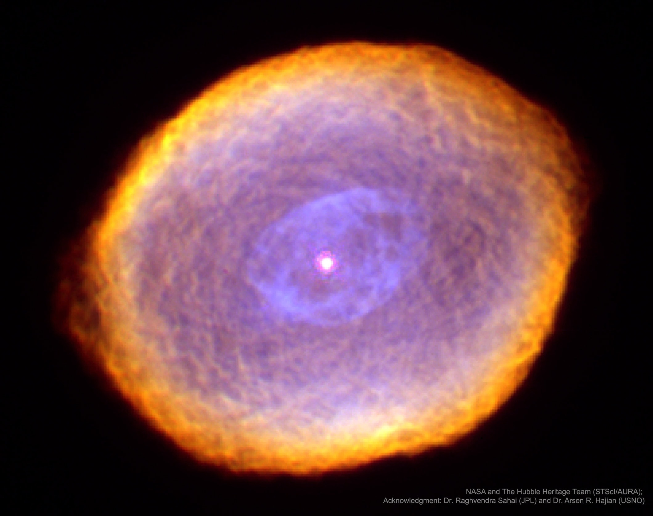 What is creating the strange texture of IC 418?  Dubbed the Spirograph Nebula for its resemblance to drawings from a cyclical drawing tool, planetary nebula IC 418 shows patterns that are not well understood. Perhaps they are related to chaotic winds from the variable central star, which changes brightness unpredictably in just a few hours.  By contrast, evidence indicates that only a few million years ago, IC 418 was probably a well-understood star similar to our Sun.  Only a few thousand years ago, IC 418 was probably a common red giant star.  Since running out of nuclear fuel, though, the outer envelope has begun expanding outward leaving a hot remnant core destined to become a white-dwarf star, visible in the image center. The light from the central core excites surrounding atoms in the nebula causing them to glow. IC 418 lies about 2000 light-years away and spans 0.3 light-years across.  This false-color image taken from the Hubble Space Telescope reveals the unusual details.