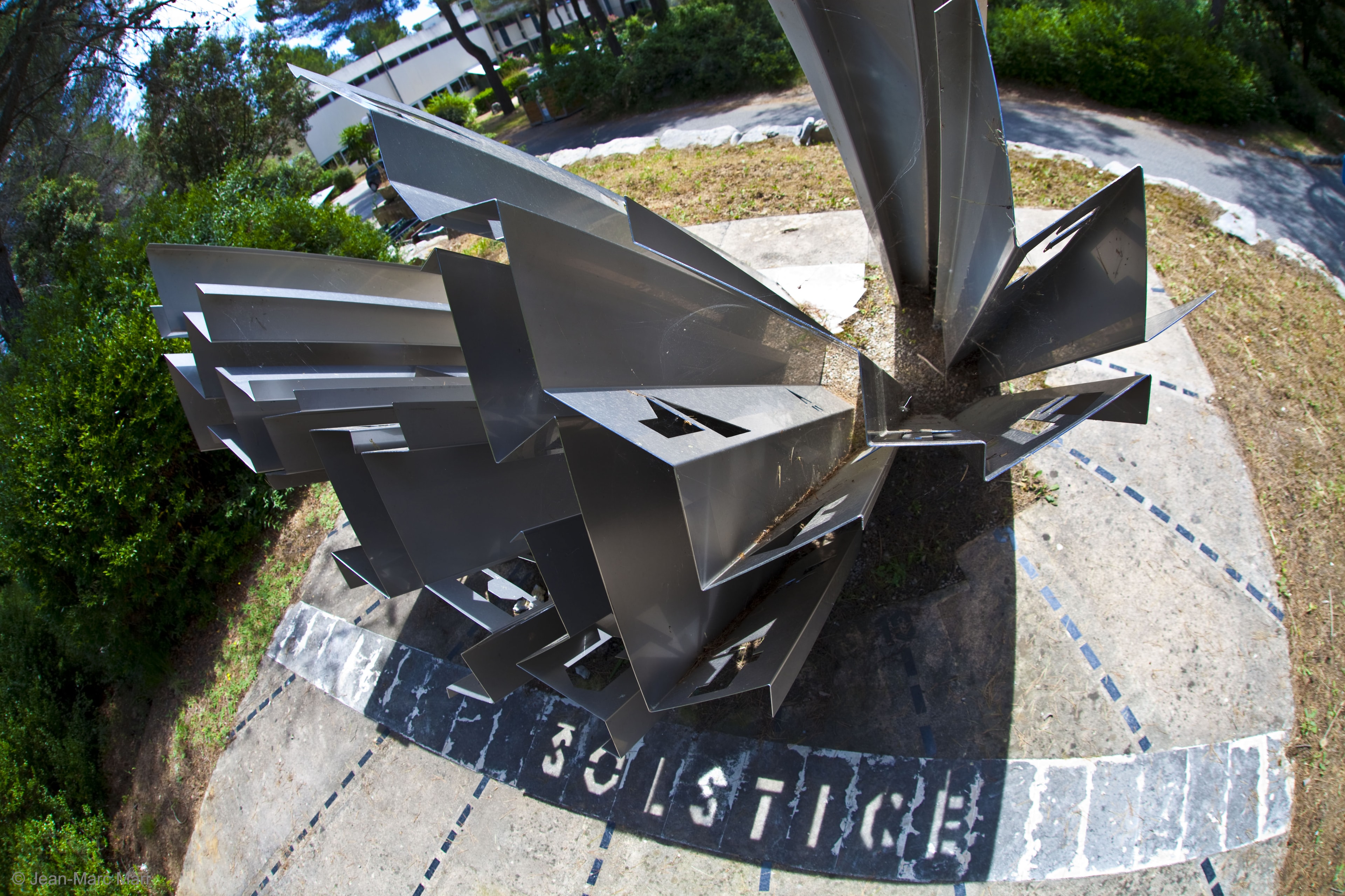 What day is it? If the day -- and time -- are right, this sundial will tell you: SOLSTICE. Only then will our  Sun be located just right for sunlight to stream through openings and spell out the term for the longest and shortest days of the year. But this will happen today (and again in December). The sundial was constructed by Jean Salins in 1980 and is situated at the Ecole Sup�rieure des Mines de Paris in Valbonne Sophia Antipolis of south-eastern France. On two other days of the year, watchers of this sundial might get to see it produce another word: EQUINOXE.