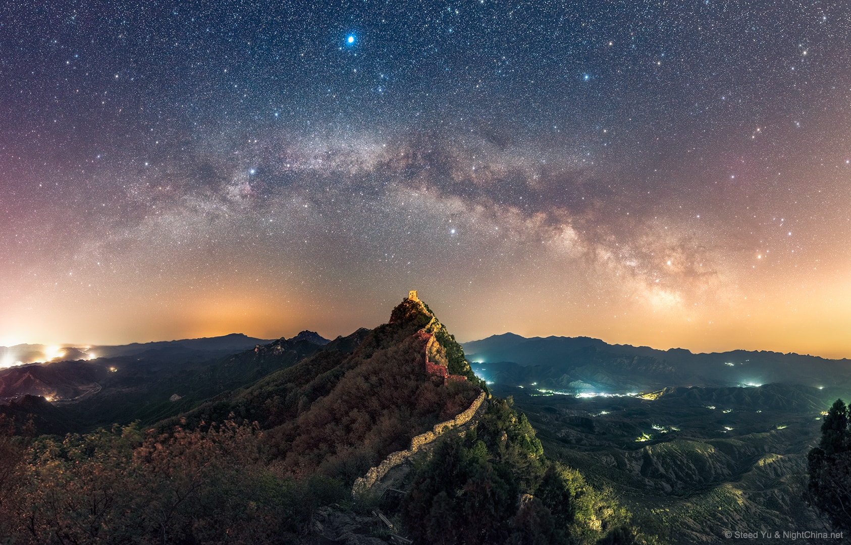 Have you ever seen the Summer Triangle? The bright stars Vega, Deneb, and Altair form a large triangle on the sky that can be seen rising in the northern spring during the morning, and rising in the northern fall during the evening.  During summer months, the triangle can be found nearly overhead near midnight as three of the brightest stars on the sky.  Featured here, along with the arch of the central band of our Milky Way Galaxy, the Summer Triangle asterism was captured this spring over the Great Wall of China. This part of the Great Wall, a World Culture Heritage Site, was built during the 6th century on the Yan Mountains. At the summit is Wangjinglou Tower from which, on a clear night, the lights of Beijing are visible in the distance.