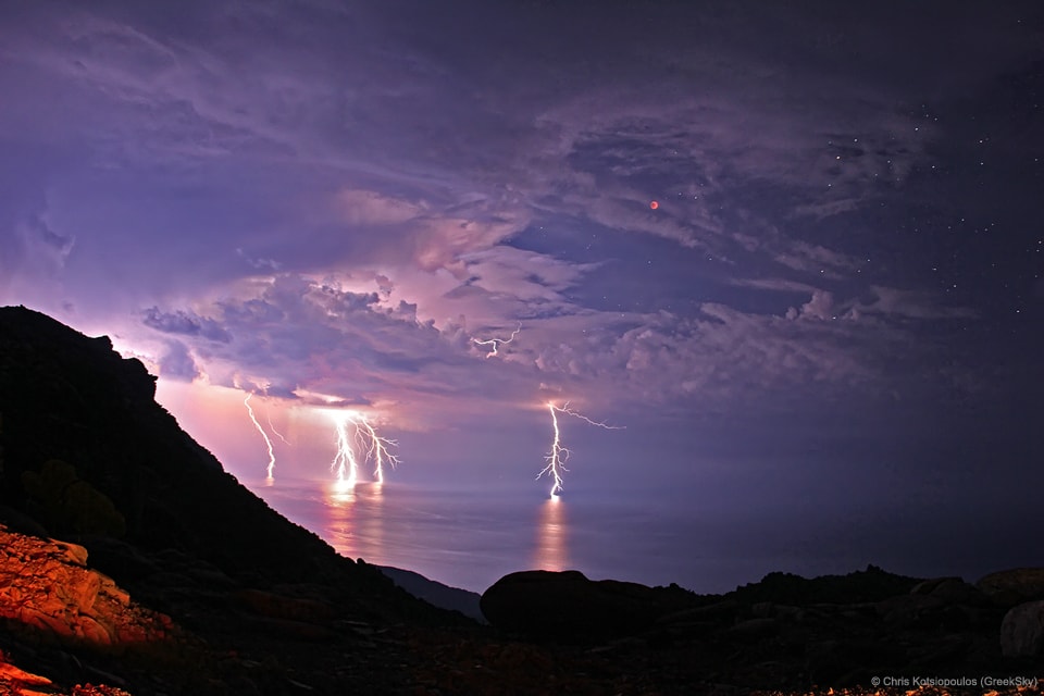 Thunderstorms almost spoiled this view of the spectacular 2011 June 15 total lunar eclipse. Instead, storm clouds parted for 10 minutes during the total eclipse phase and lightning bolts contributed to the dramatic sky. Captured with a 30-second exposure the scene also inspired one of the more memorable titles (thanks to the astrophotographer) in APOD's now 22-year history.  Of course, the lightning reference clearly makes sense, and the shadow play of the dark lunar eclipse was widely viewed across planet Earth in Europe, Africa, Asia, and Australia. The picture itself, however, was shot from the Greek island of Ikaria at Pezi. That area is known as "the planet of the goats" because of the rough terrain and strange looking rocks.    Details: Total Solar Eclipse on 2017 August 21