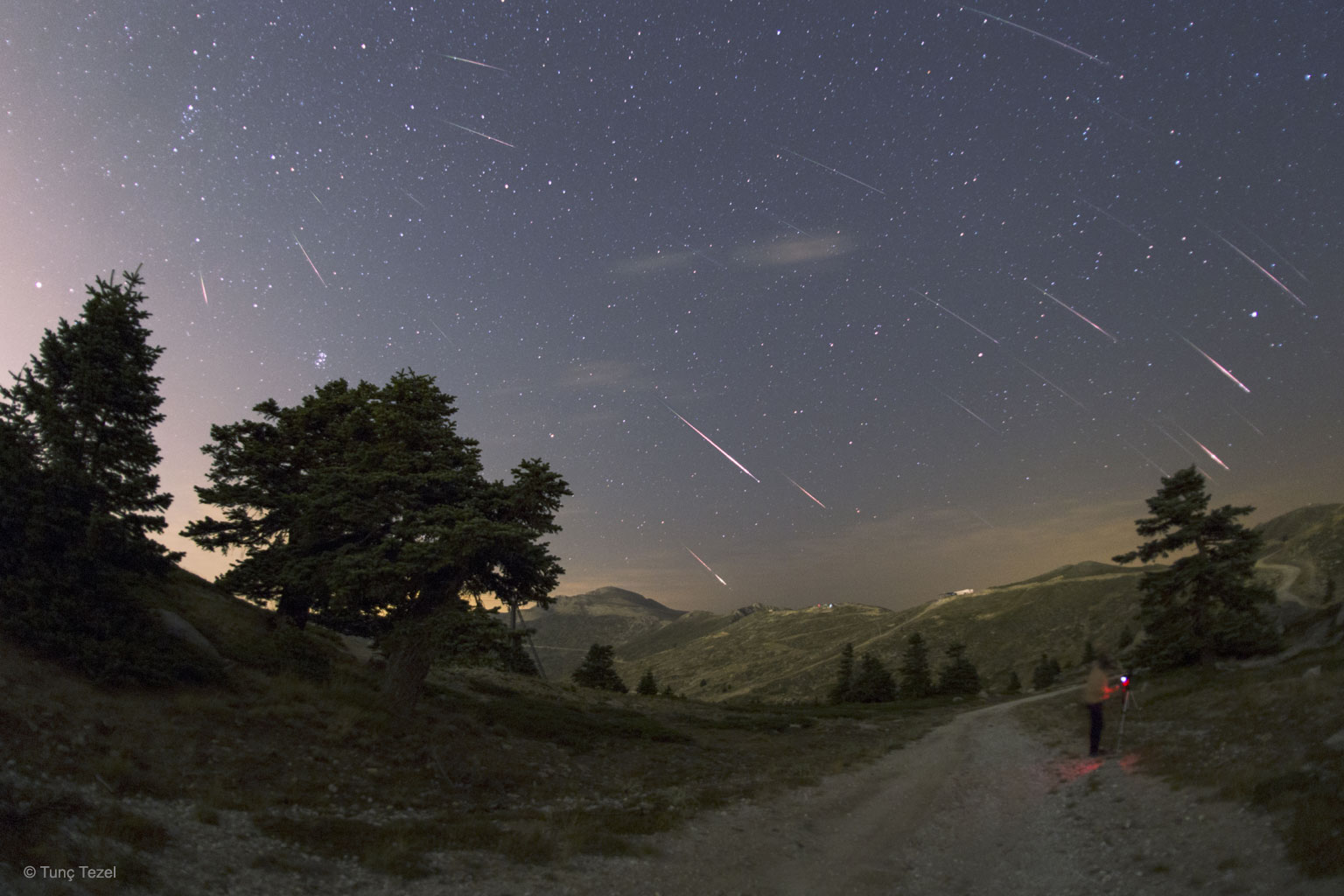 The Perseid Meteor Shower, usually the best meteor shower of the year, will peak late next week.   A person watching a clear sky from a dark location might see a bright meteor every minute.  These meteors are actually specks of rock that have broken off Comet Swift-Tuttle and continued to orbit the Sun until they vaporize in Earth's atmosphere.  The featured composite image shows a outburst of Perseids as they appeared over Turkey during last year's meteor shower.  Enough meteors were captured to trace the shower's radiant back to the constellation of Perseus on the far left.  The tail-end of the Perseids will still be going during the total solar eclipse on August 21, creating a rare opportunity for some lucky astrophotographers to image a Perseid meteor during the day.   Memorable APOD: Meteor Showers