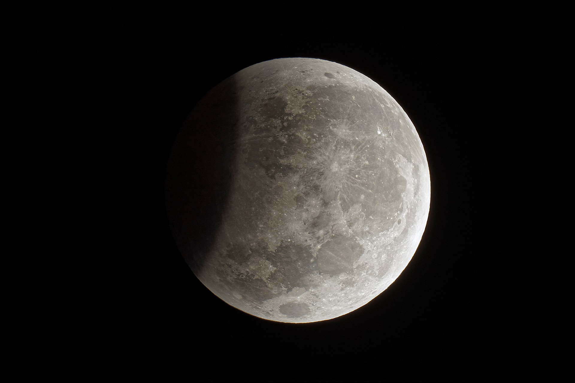 August's Full Moon is framed in this sharp, high dynamic range composition. Captured before sunrise on August 8 from Sydney, Australia, south is up and the curve of the Earth's dark, umbral shadow is at the left, near the maximum phase of a partial lunar eclipse. Kicking off the eclipse season, this time the Full Moon's grazing slide through Earth's shadow was visible from the eastern hemisphere. Up next is the much anticipated total solar eclipse of August 21. Then, the New Moon's shadow track will include North America, the narrow path of totality running coast to coast through the United States.