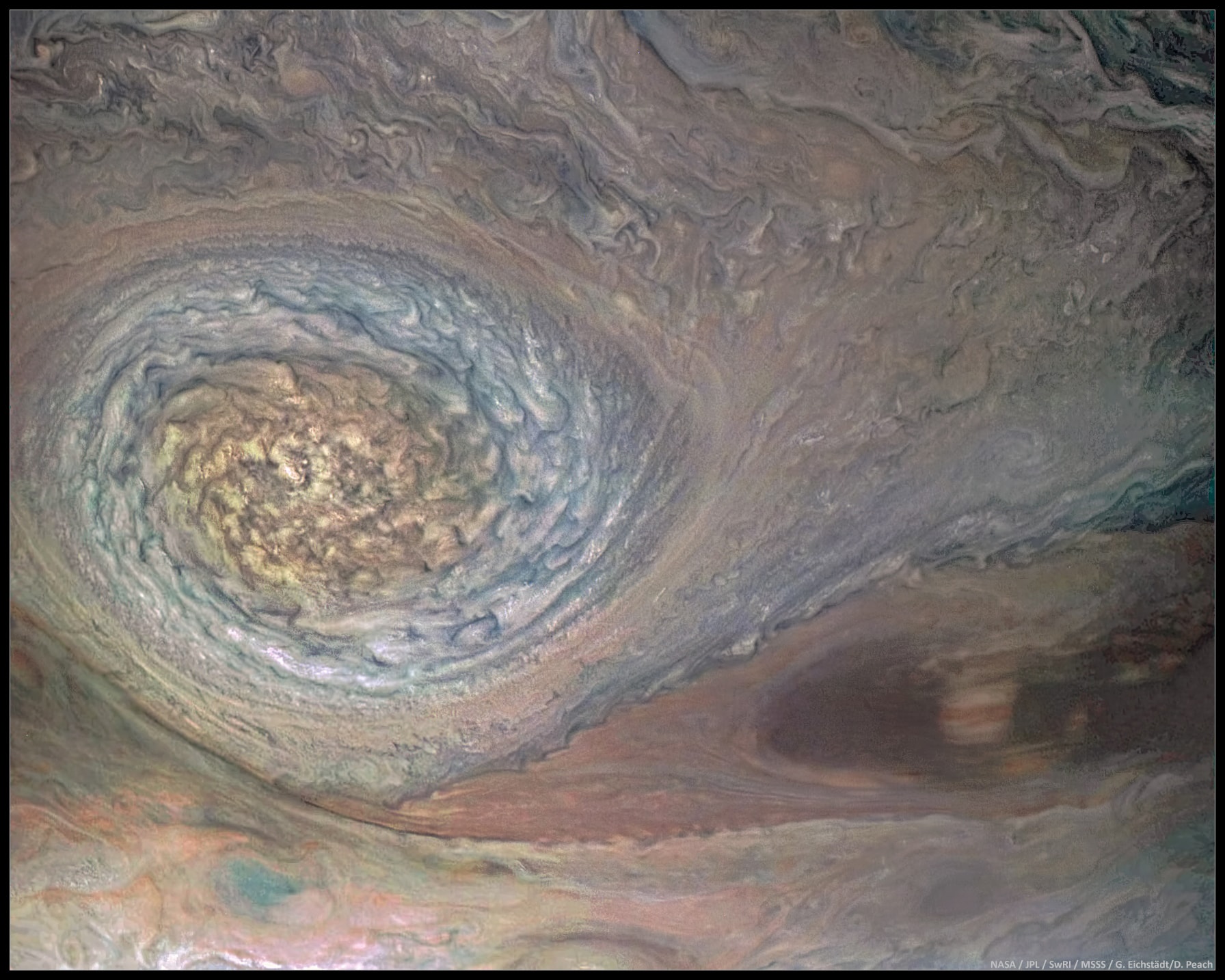 On July 11, the Juno spacecraft once again swung near the turbulent Jovian cloud tops. On its seventh orbital closest approach this perijove passage brought Juno within 3,500 kilometers of the Solar System's largest planetary atmosphere. Near perijove the rotating JunoCam was able to record this stunning, clear view of one of Jupiter's signature vortices. About 8,000 kilometers in diameter, the anticyclonic storm system was spotted in Jupiter's North North Temperate Zone in the 1990s. That makes it about half the size of an older and better known Jovian anticyclone, the Great Red Spot, but only a little smaller than planet Earth. At times taking on reddish hues, the enormous storm system is fondly known as a North North Temperate Zone Little Red Spot.