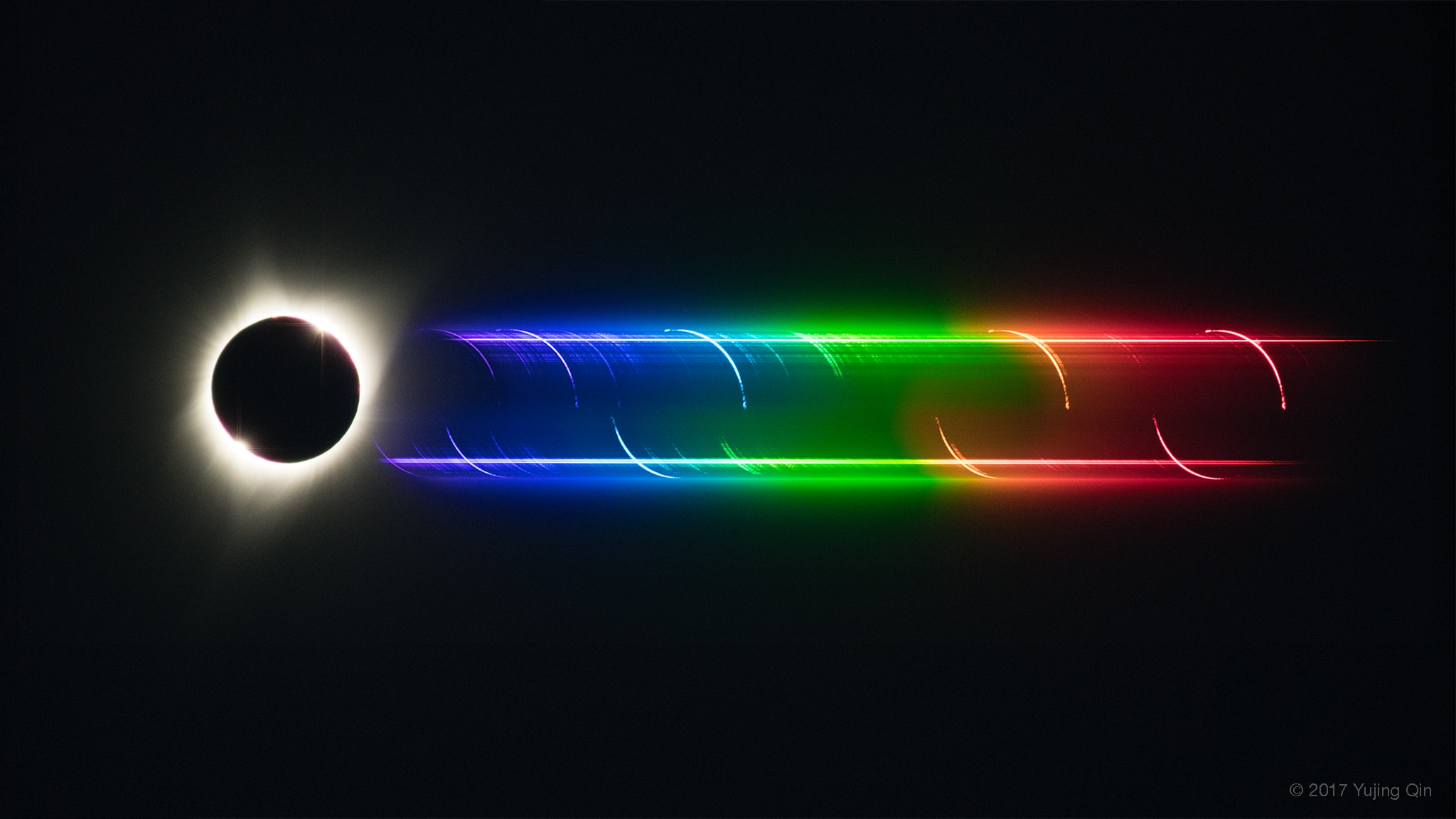 In clear Madras, Oregon skies, this colorful eclipse composite captured the elusive chromospheric or flash spectrum of the Sun. Only three exposures, made on August 21 with telephoto lens and diffraction grating, are aligned in the frame. Directly imaged at the far left, the Sun's diamond ring-like appearance at the beginning and end of totality brackets a silhouette of the lunar disk at maximum eclipse. Spread by the diffraction grating into the spectrum of colors toward the right, the Sun's photospheric spectrum traces the two continuous streaks. They correspond to the diamond ring glimpses of the Sun's normally overwhelming disk. But individual eclipse images also appear at each wavelength of light emitted by atoms along the thin, fleeting arcs of the solar chromosphere. The brightest images, or strongest chromospheric emission, are due to Hydrogen atoms. Red hydrogen alpha emission is at the far right with blue and purple hydrogen series emission to the left. In between, the brightest yellow emission is caused by atoms of Helium, an element only first discovered in the flash spectrum of the Sun.