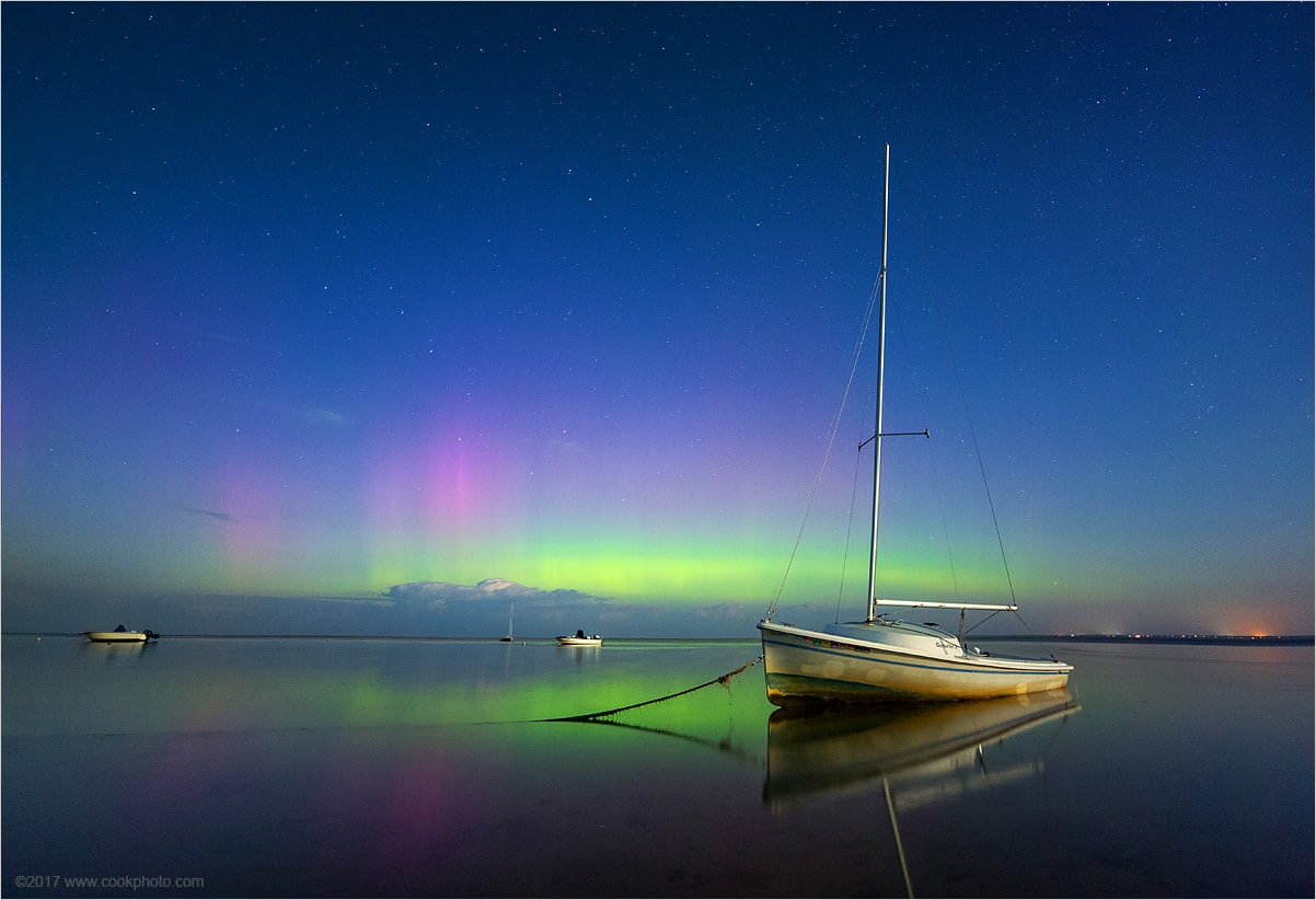 Very recognizable stars of the northern sky are a backdrop for calm waters in this moonlit sea and skyscape off Cape Cod, Massachusetts. Taken on September 7, the photo also records a colorful display of northern lights or aurora borealis triggered by a severe geomagnetic storm. Visible crossing the Sun, the giant solar active region responsible, AR 2673, is much larger than planet Earth. It has produced the strongest flare of the current solar cycle and and the Earth-directed coronal mass ejection in the last few days.