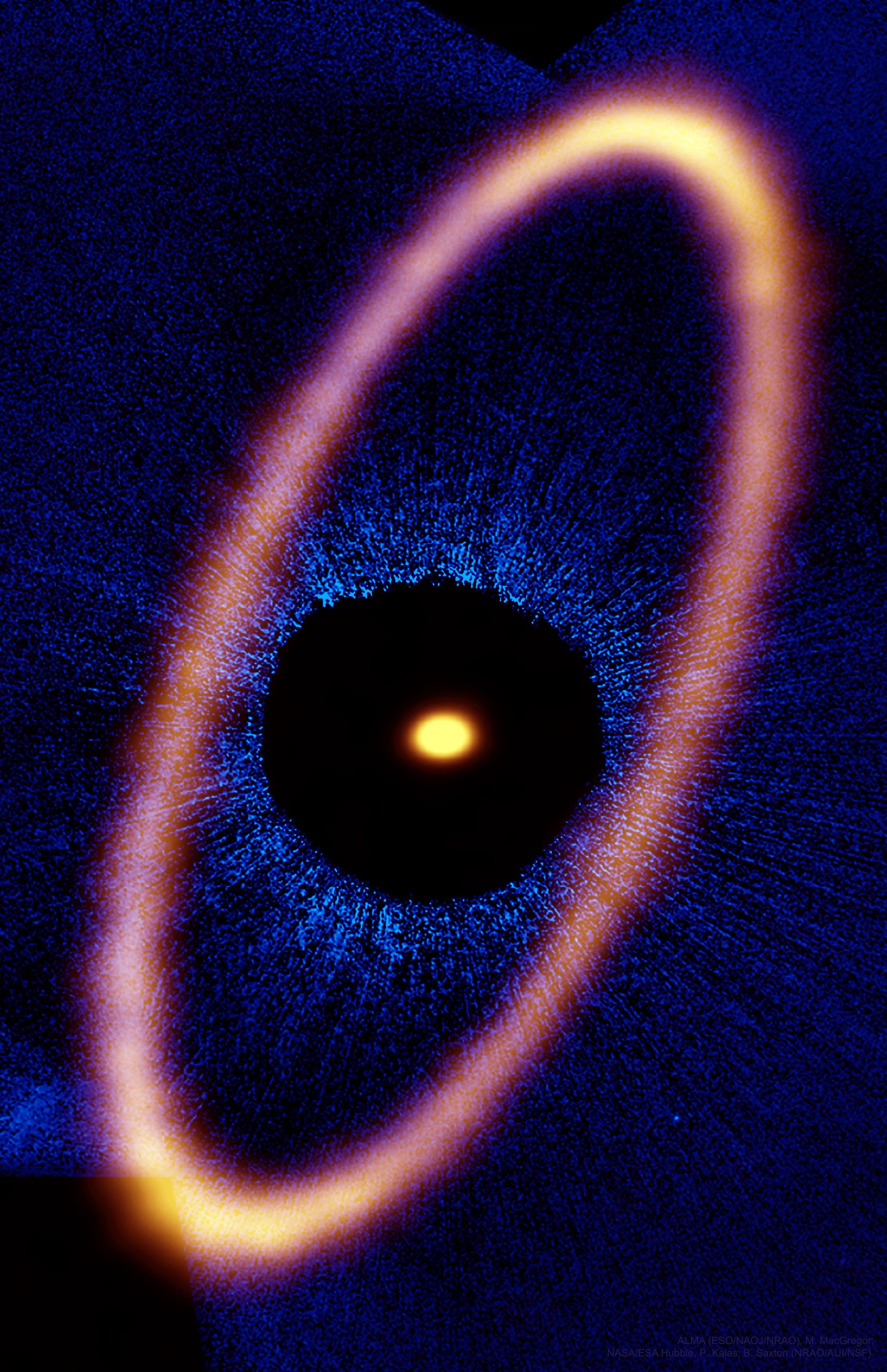 Why is there a large ice ring around Fomalhaut? This interesting star -- easily visible in the night sky -- lies only about 25 light-years away and is known to be orbited by at least one planet, Dagon, as well as several inner dust disks.  More intriguing, perhaps, is an outer ring, first discovered about 20 years ago, that has an unusually sharp inner boundary. The featured recent image by the Atacama Large Millimeter Array (ALMA) shows this outer ring with complete and unprecedented detail -- in pink -- superposed on a Hubble image of the Fomalhaut system in blue.  A leading theory holds that this ring resulted from numerous violent collisions involving icy comets and planetesimals, the component objects of planets, while the ring boundaries are caused by the gravity of yet unseen planets.  If correct, any interior planets in the Fomalhaut system are likely being continually pelted by large meteors and comets -- an onslaught last seen in our own planetary system four billion years ago in an episode called the Late Heavy Bombardment.    Free Download: The 2018 APOD Calendar