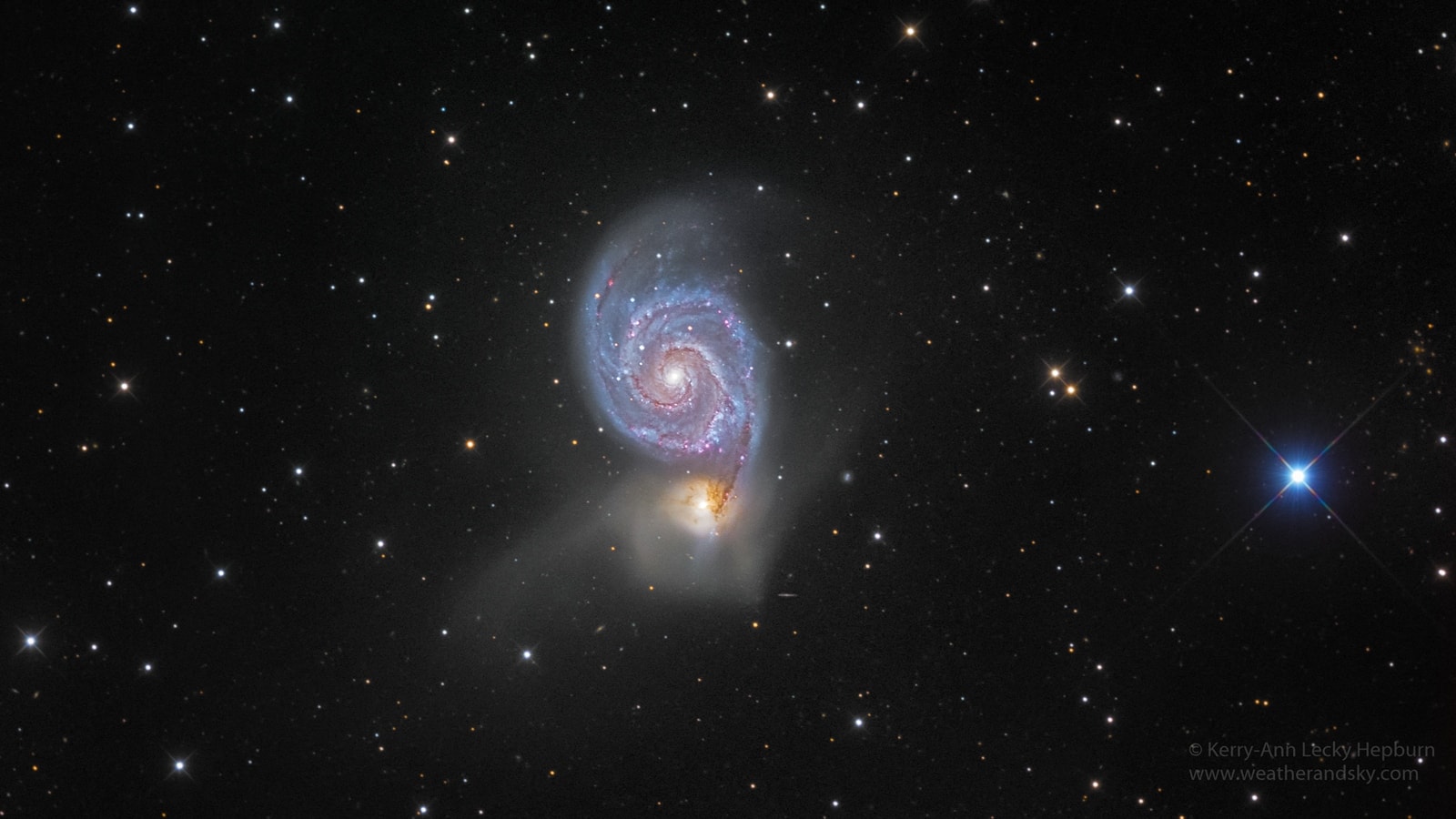 Find the Big Dipper and follow the handle away from the dipper's bowl until you get to the last bright star. Then, just slide your telescope a little south and west and you'll come upon this stunning pair of interacting galaxies, the 51st entry in Charles Messier's famous catalog. Perhaps the original spiral nebula, the large galaxy with well defined spiral structure is also cataloged as NGC 5194. Its spiral arms and dust lanes clearly sweep in front of its companion galaxy (bottom), NGC 5195. The pair are about 31 million light-years distant and officially lie within the angular boundaries of the small constellation Canes Venatici. Though M51 looks faint and fuzzy to the eye, deep images like this one can reveal striking colors and the faint tidal debris around the smaller galaxy