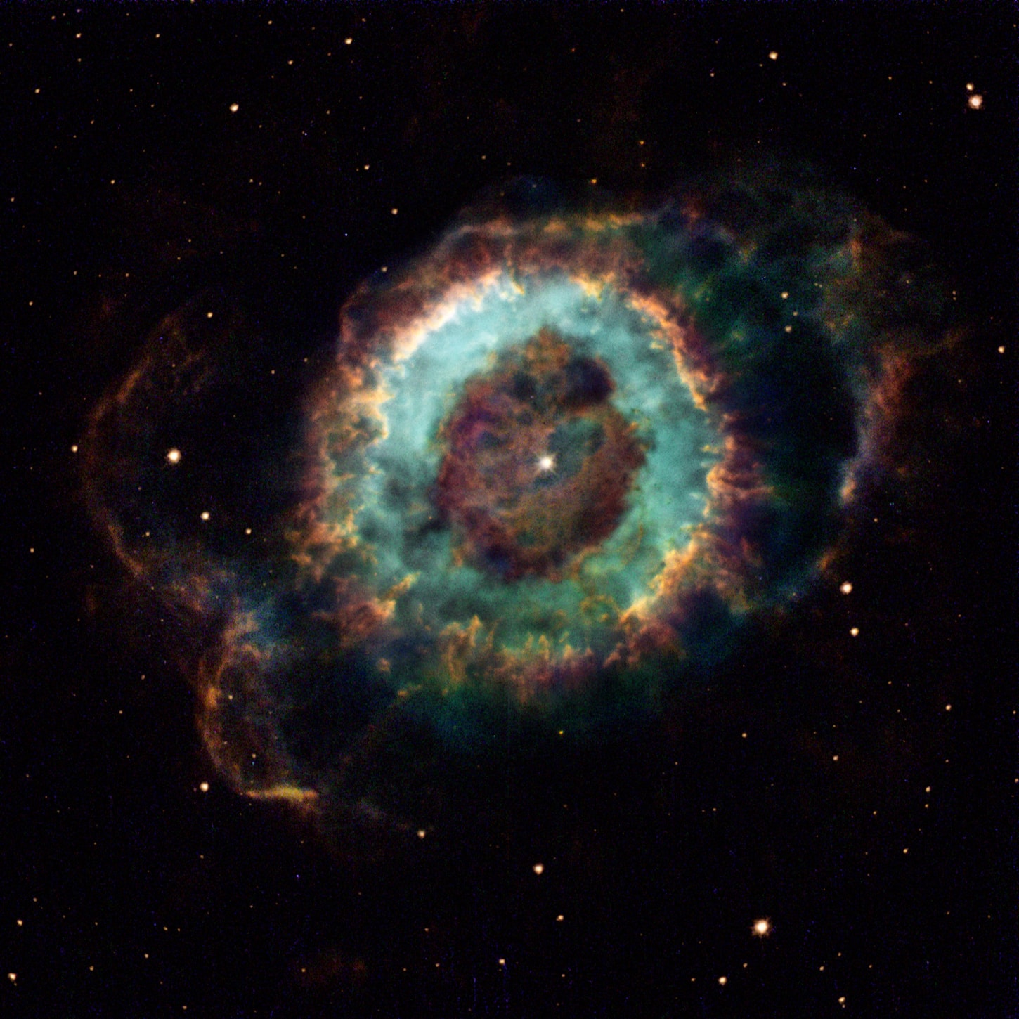 Wraithlike NGC 6369 is a faint apparition in night skies popularly known as the Little Ghost Nebula. It was discovered by 18th century astronomer Sir William Herschel as he used a telescope to explore the medicinal constellation Ophiucus. Herschel historically classified the round and planet-shaped nebula as a Planetary Nebula. But planetary nebulae in general are not at all related to planets. Instead they are gaseous shrouds created at the end of a sun-like star's life, the dying star's outer layers expanding into space while its core shrinks to become a white dwarf. The transformed white dwarf star, seen near the center, radiates strongly at ultraviolet wavelengths and powers the expanding nebula's glow. Surprisingly complex details and structures of NGC 6369 are revealed in this tantalizing image composed from Hubble Space Telescope data. The nebula's main round structure is about a light-year across and the glow from ionized oxygen, hydrogen, and nitrogen atoms are colored blue, green, and red respectively. Over 2,000 light-years away, the Little Ghost Nebula offers a glimpse of the fate of our Sun, which could produce its own planetary nebula about 5 billion years from now.