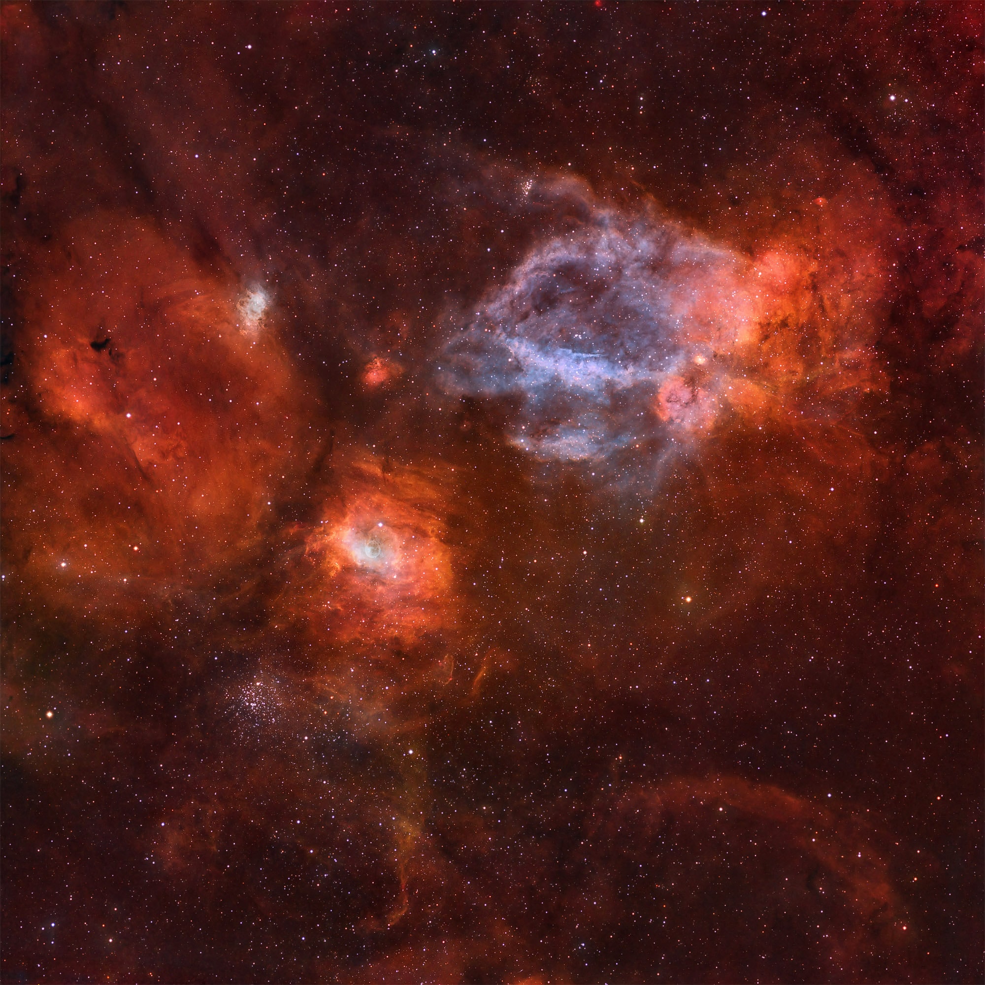 Adrift in a cosmic sea of stars and glowing gas the delicate, floating apparition left of center in this widefield view is cataloged as NGC 7635, the Bubble Nebula. A mere 10 light-years wide, the tiny Bubble Nebula was blown by the winds of a massive star. It lies within a larger complex of interstellar gas and dust clouds found about 11,000 light-years distant, straddling the boundary between the parental constellations Cepheus and Cassiopeia. Included in the breathtaking vista is open star cluster M52 (lower left), some 5,000 light-years away. Above and right of the Bubble Nebula is an emission region identified as Sh2-157, also known as the Claw Nebula. Constructed from 47 hours of narrow-band and broad-band exposures, this image spans about 3 degrees on the sky. That corresponds to a width of 500 light-years at the estimated distance of the Bubble Nebula.