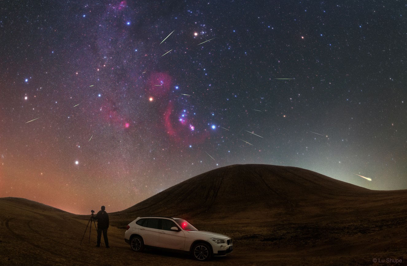 Meteors have been shooting out from the constellation of Orion.  This was expected, as October is the time of year for the Orionids Meteor Shower.  Pictured here, over a dozen meteors were caught in successively added exposures last weekend over Wulan Hada volcano in Inner Mongolia, China. The featured image shows multiple meteor streaks that can all be connected to a single small region on the sky called the radiant, here visible just above and to the left of the belt of Orion,  The Orionids meteors started as sand sized bits expelled from Comet Halley during one of its trips to the inner Solar System.  Comet Halley is actually responsible for two known meteor showers, the other known as the Eta Aquarids and visible every May.  Next month, the Leonids Meteor Shower from Comet Tempel-Tuttle should also result in some bright meteor streaks.   Free Download: The 2018 APOD Calendar