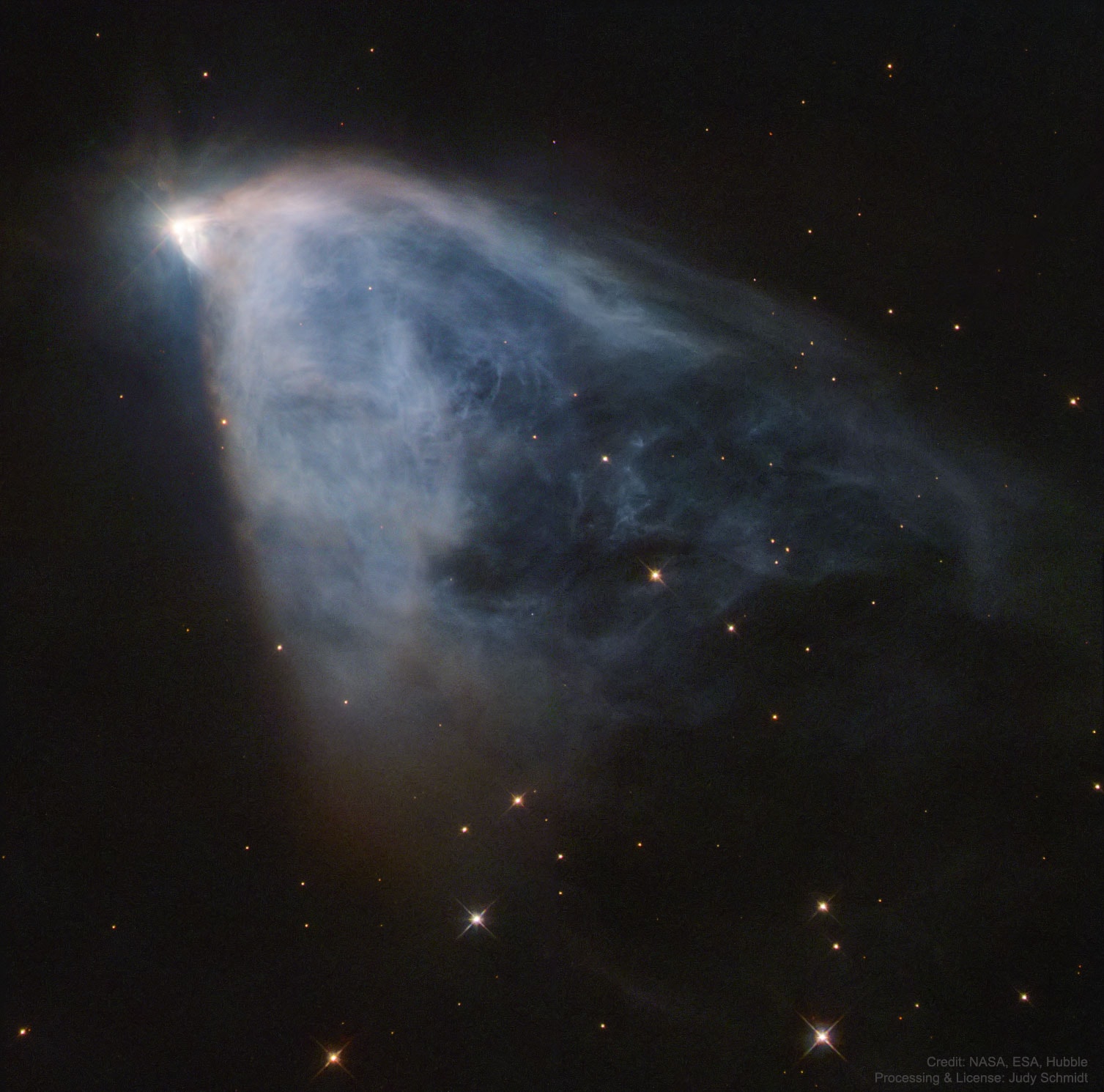 What causes Hubble's Variable Nebula to vary?  The unusual nebula featured here changes its appearance noticeably in just a few weeks.  Discovered over 200 years ago and subsequently cataloged as NGC 2261, the remarkable nebula is named for Edwin Hubble, who studied it early last century.  Fitting, perhaps, the featured image was taken by another namesake of Hubble: the Space Telescope. Hubble's Variable Nebula is a reflection nebula made of gas and fine dust fanning out from the star R Monocerotis.  The faint nebula is about one light-year across and lies about 2500 light-years away towards the constellation of the Unicorn  (Monocerotis).  The leading variability explanation for Hubble's Variable Nebula holds that dense knots of opaque dust pass close to R Mon and cast moving shadows onto the reflecting dust seen in the rest of the nebula.   Open Science: Browse 1,500+ codes in the Astrophysics Source Code Library
