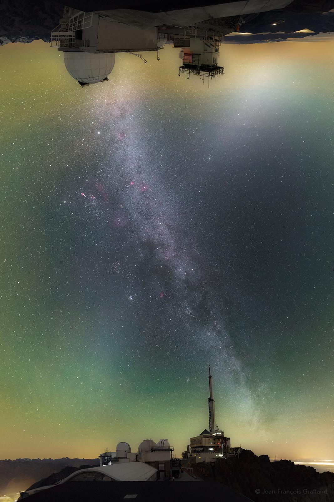Follow this vertical panoramic view from horizon to horizon and your gaze will sweep through the zenith of a dark night sky over Pic du Midi mountaintop observatory. To make the journey above a sea of clouds, 19 single exposures were taken near the end of night on October 31 and assembled in a mercator projection that renders the two horizons flat. Begin at the top and you're looking east toward the upsidedown dome of the observatory's 1 meter telescope. It's easy to follow the plane of our Milky Way galaxy as it appears to emerge from the dome and angle down toward the far horizon. Just to its right, the sky holds a remarkable diffuse glow of zodiacal light along our Solar System's ecliptic plane. Zodiacal light and Milky Way with star clusters, cosmic dust clouds and faint nebulae, cross near the zenith. Both continue down toward the airglow in the west. They disappear near the western horizon at the bottom, beyond more Pic du Midi observatory domes and a tall communications relay antenna.