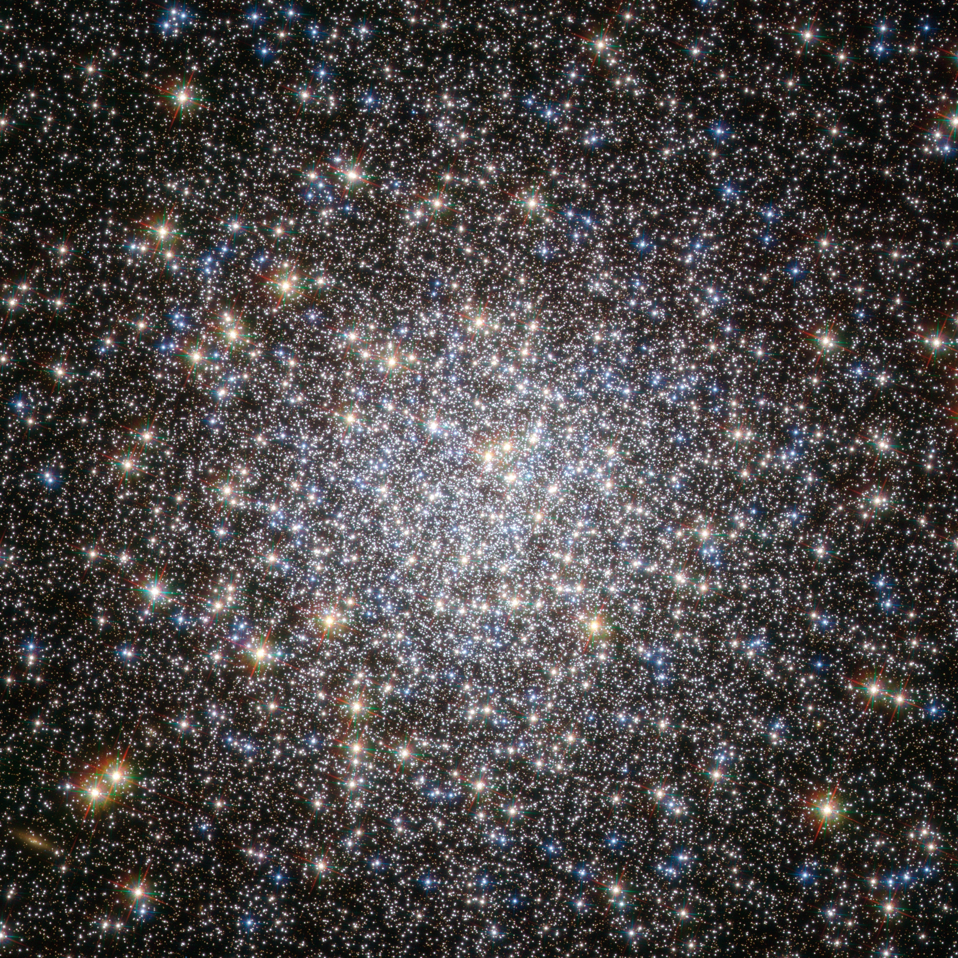 "Beautiful Nebula discovered between the Balance [Libra] & the Serpent [Serpens] ..." begins the description of the 5th entry in 18th century astronomer Charles Messier's famous catalog of nebulae and star clusters. Though it appeared to Messier to be fuzzy and round and without stars, Messier 5 (M5) is now known to be a globular star cluster, 100,000 stars or more, bound by gravity and packed into a region around 165 light-years in diameter. It lies some 25,000 light-years away. Roaming the halo of our galaxy, globular star clusters are ancient members of the Milky Way. M5 is one of the oldest globulars, its stars estimated to be nearly 13 billion years old. The beautiful star cluster is a popular target for Earthbound telescopes. Of course, deployed in low Earth orbit on April 25, 1990, the Hubble Space Telescope has also captured its own stunning close-up view that spans about 20 light-years across the central region of M5. Even close to its dense core the cluster's aging red and blue giant stars and rejuvenated blue stragglers stand out in yellow and blue hues in the sharp color image.