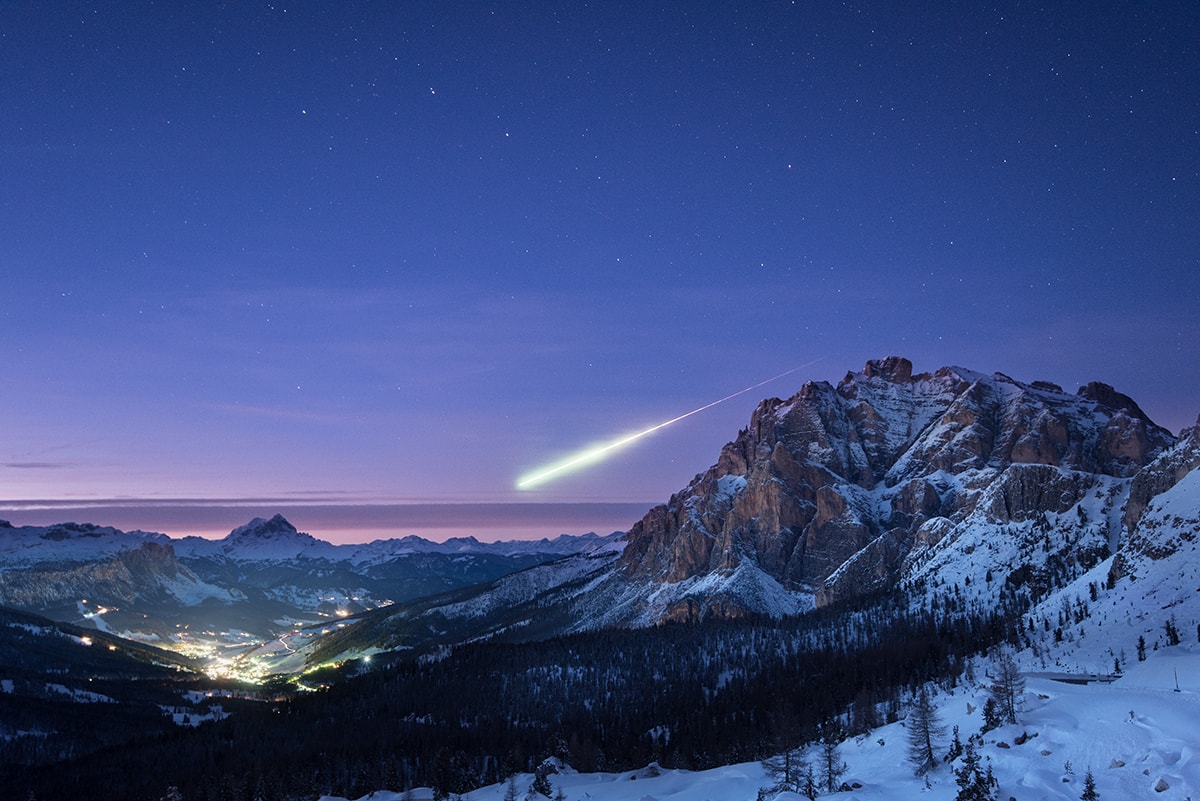 The sky glows with soft pinkish colors of fading twilight in this serendipitous mountaintop vista.  Taken in subfreezing temperatures, the thoughtfully composed photo shows snowy, rugged peaks seen from a mountain pass on November 14. Below lies the village of La Villa, Alta Badia in Italy's Dolomite Alps. Above the nestled village lights, the constellation Ursa Major hangs over the northern horizon. But most stunning is the intense fireball meteor. It was captured during the camera's exposure by chance as it flashed east to west across the northern horizon, under Ursa Major's familiar Big Dipper asterism. In fact, sightings of this major fireball meteor were widely reported in European skies, the most reported fireball event ever for planet Earth's American Meteor Society and the International Meteor Organization. The meteor's measured track over Germany is consistent with its origin near the active radiant of November's Taurid Meteor Shower. Taurid meteors are associated with dust from Encke's comet.  Watch: Leonid Meteor Shower