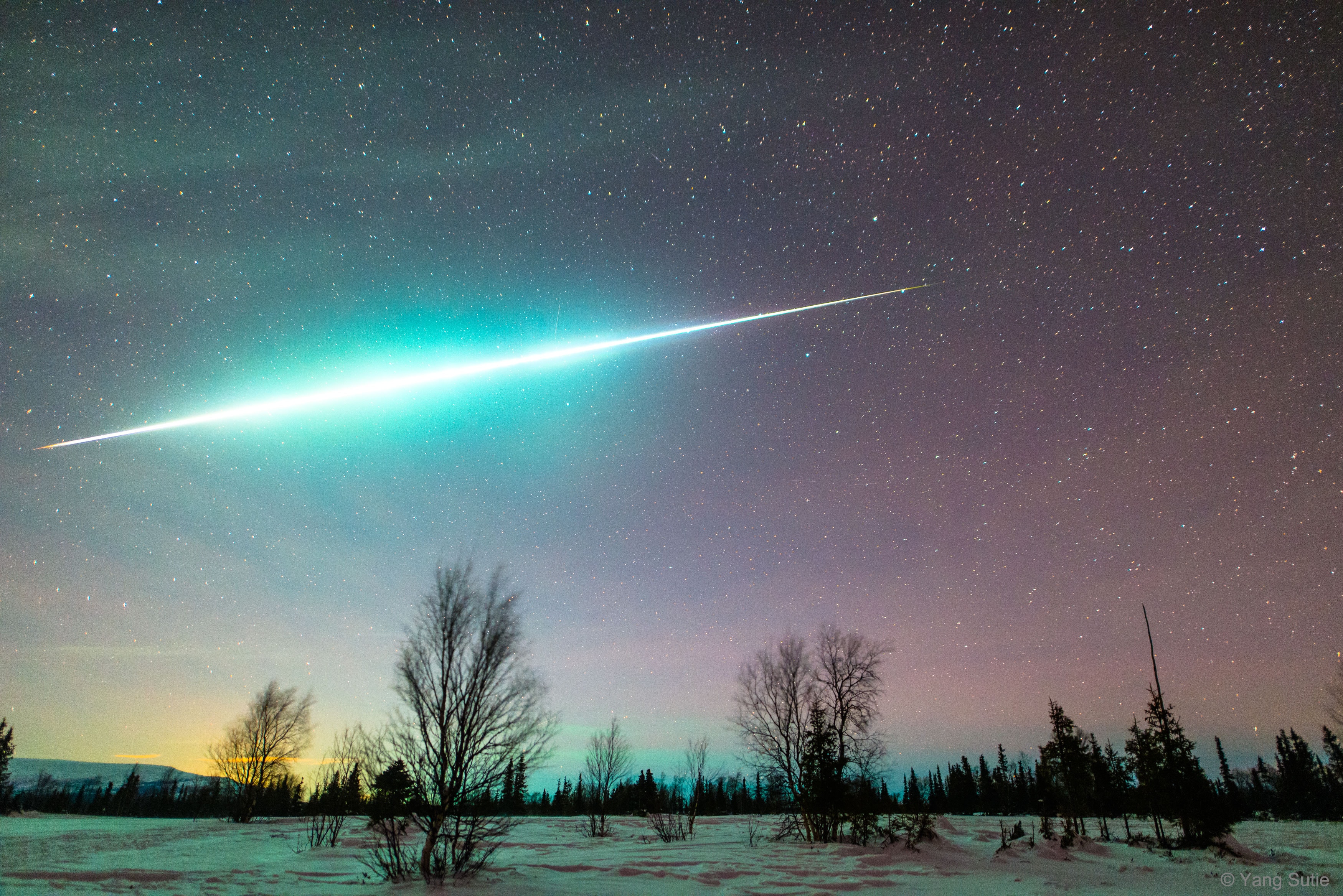 Something very bright suddenly lit up the arctic -- what was it? The original idea was to take a series of aurora images that could be made into a time-lapse video.  But when night suddenly turned into day, the astrophotographer quickly realized that he was seeing something even more spectacular. Moving through the sky -- in front of the Big Dipper no less -- was a Geminid meteor so bright it could be called a fireball. The meteor brightened and flashed for several seconds as it went.  By a stroke of good fortune, the aurora camera was able to capture the whole track. Taken the night after the Geminids Meteor Shower peaked, the astrophotographer's location was near Lovozero Lake in Murmansk, Russia, just north of the Arctic Circle.   Free APOD Lectures: January 5 in NYC & January 9 in DC