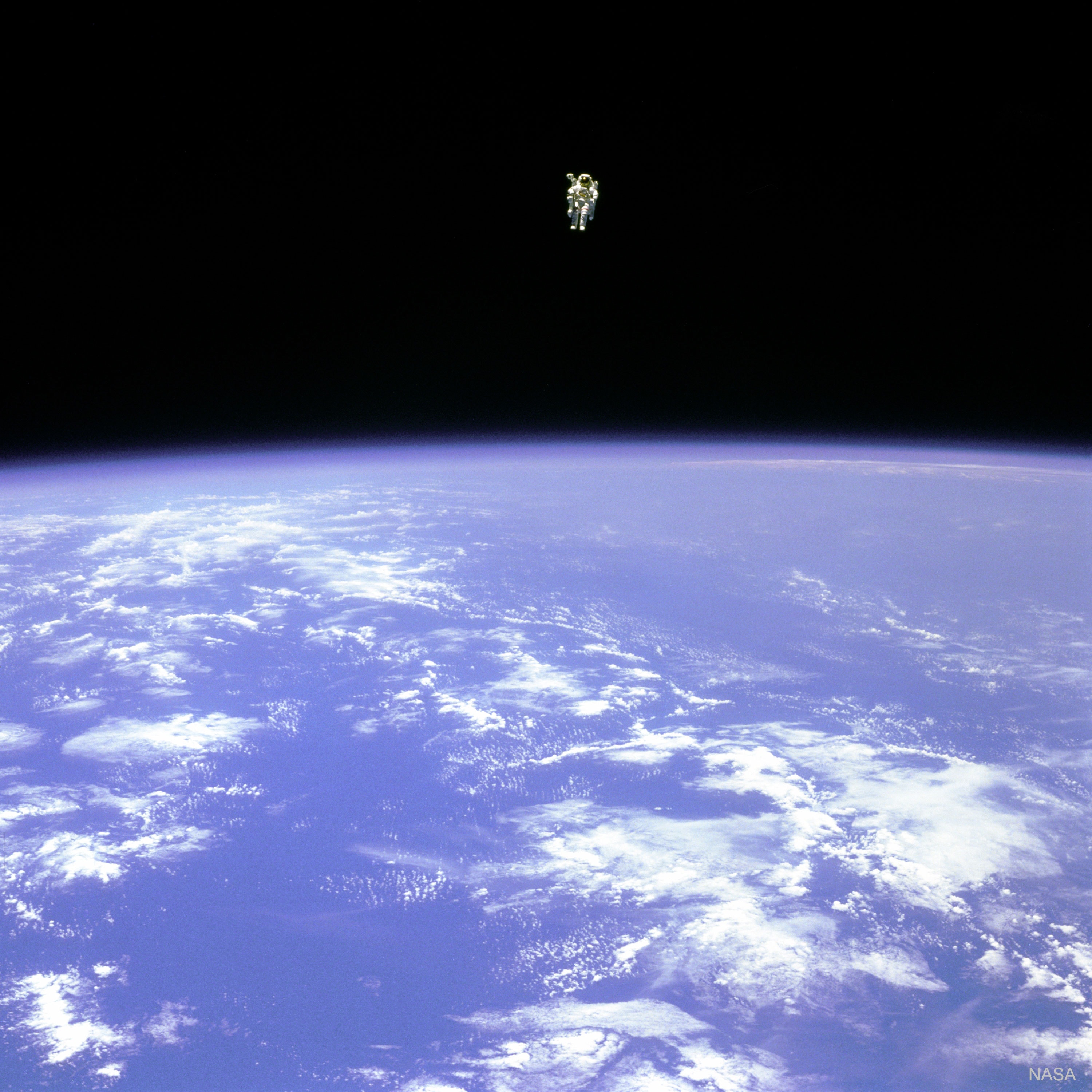 What would it be like to fly free in space?  At about 100 meters from the cargo bay of the space shuttle Challenger, Bruce McCandless II was living the dream -- floating farther out than anyone had ever been before.  Guided by a Manned Maneuvering Unit (MMU), astronaut McCandless, pictured, was floating free in space. McCandless and fellow NASA astronaut Robert Stewart were the first to experience such an "untethered space walk" during Space Shuttle mission 41-B in 1984.  The MMU worked by shooting jets of nitrogen and was used to help deploy and retrieve satellites.  With a mass over 140 kilograms, an MMU is heavy on Earth, but, like everything, is weightless when drifting in orbit. The MMU was replaced with the SAFER backpack propulsion unit.   Memorial: Astronaut Bruce McCandless II Dies at 80