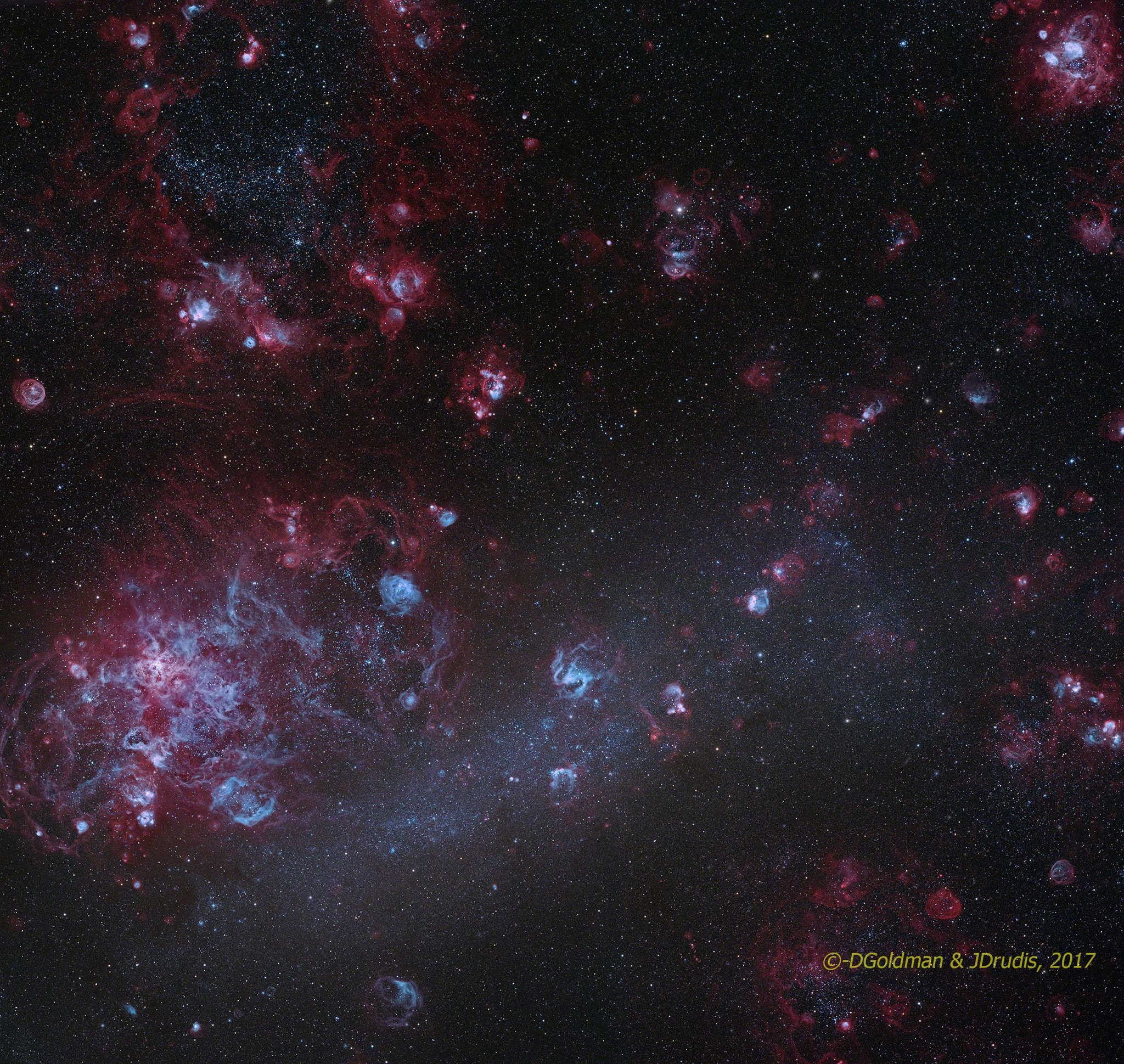 An alluring sight in southern skies, the Large Magellanic Cloud (LMC) is seen in this deep and detailed telescopic mosaic. Recorded with broadband and narrowband filters, the scene spans some 5 degrees or 10 full moons. The narrowband filters are designed to transmit only light emitted by hydrogen, and oxygen atoms. Ionized by energetic starlight, the atoms emit their characteristic light as electrons are recaptured and the atoms transition to a lower energy state. As a result, in this image the LMC seems covered with its own clouds of ionized gas surrounding its massive, young stars. Sculpted by the strong stellar winds and ultraviolet radiation, the glowing clouds, dominated by emission from hydrogen, are known as H II (ionized hydrogen) regions. Itself composed of many overlapping H II regions, the Tarantula Nebula is the large star forming region at the left. The largest satellite of our Milky Way Galaxy, the LMC is about 15,000 light-years across and lies a mere 160,000 light-years away toward the constellation Dorado.