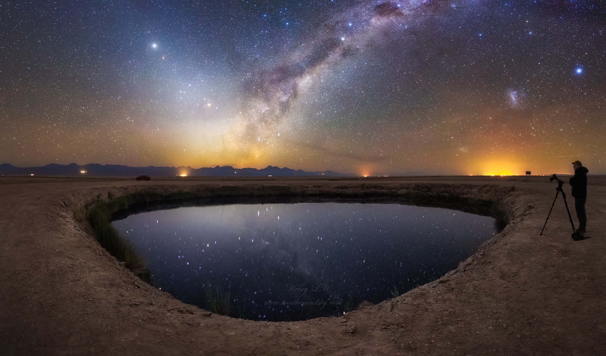 Staring toward the heavens, one of the many lagunas in the Atacama Desert salt flat calmly reflects a starry night sky near San Pedro de Atacama, Chile, planet Earth. Cosmic rifts of dust, star clouds, and nebulae of the central Milky Way galaxy are rising in the east, beyond a volcanic horizon. Caught in the six frame panorama serenely recorded in the early morning hours of January 15, planets Jupiter and Mars are close. Near the ecliptic, the bright planets are immersed in the Solar System's visible band of Zodiacal light extending up and left from the galactic center.  Above the horizon to the south (right) are the Large and Small clouds of Magellan, satellite galaxies of the Milky Way.