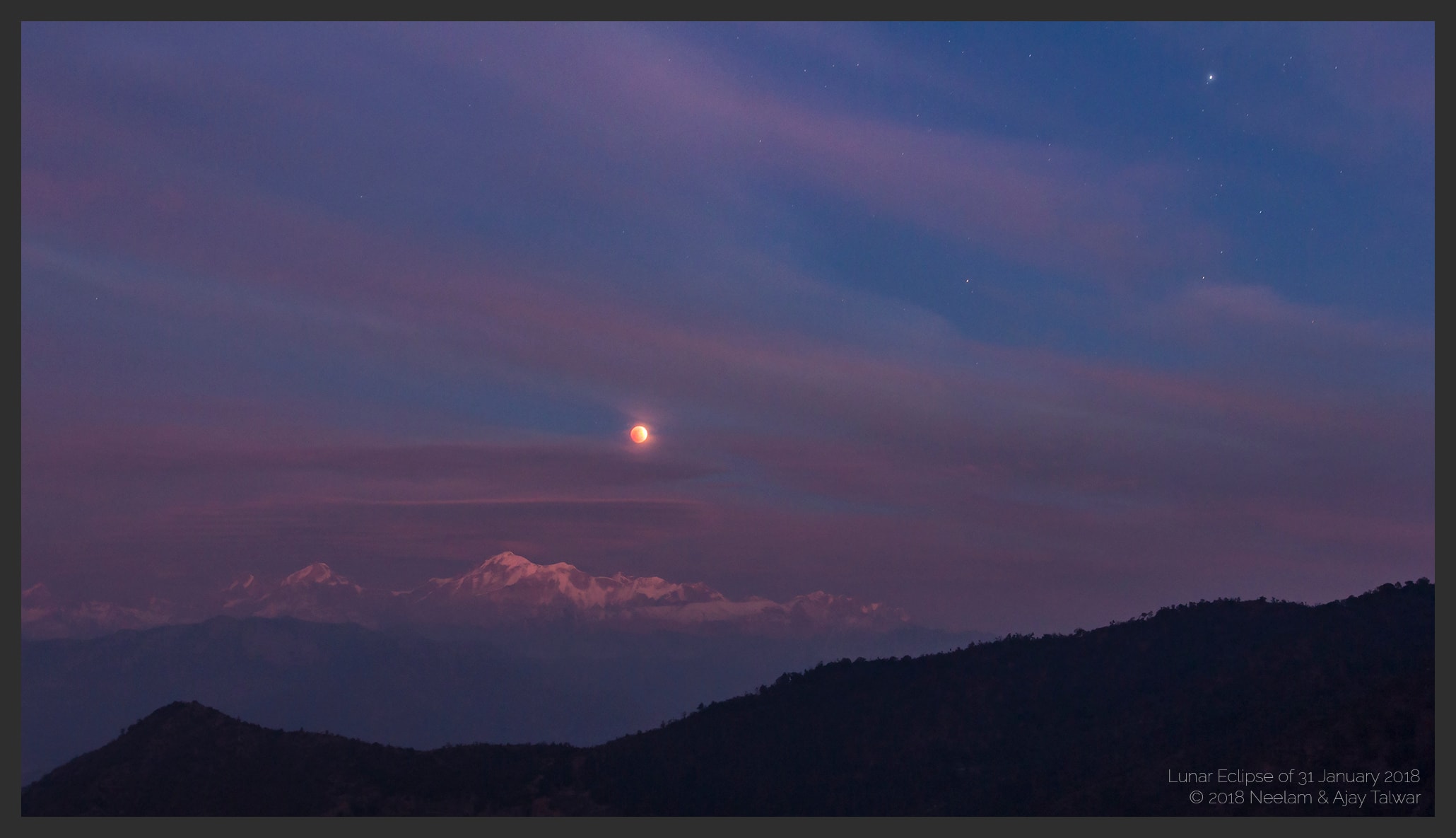 This atmospheric picture of a distant horizon looks toward the tall Trisul peaks of India's snowy Himalayan mountains. Taken from a remote location on January 31, bright star Procyon shines at the upper right. The red Moon rising is gliding through Earth's shadow during the evening's much anticipated total lunar eclipse. Enjoyed across the planet's night side, the eclipse was the first of two total lunar eclipses in 2018, kicking off a good year for moonwatchers. But this was a rare treat. The eclipsed Moon also loomed large near perigee, the closest point in its orbit, during the second Full Moon of the month, also known as a Blue Moon. For the July 27, 2018 total lunar eclipse, the Full Moon will be very near apogee.