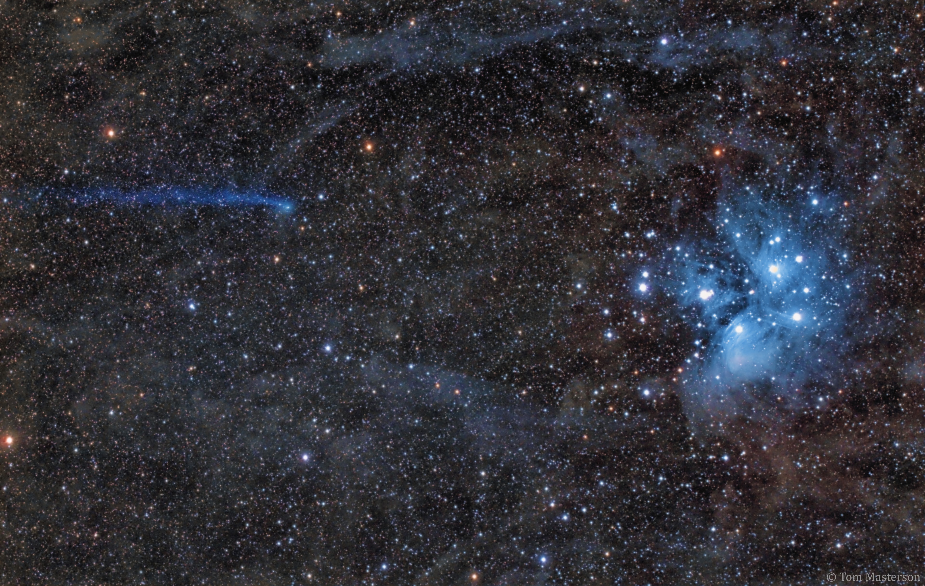 What's that heading for the Pleiades star cluster? It appears to be Comet C/2016 R2 (PanSTARRS), but here, appearances are deceiving.  On the right and far in the background, the famous Pleiades star cluster is dominated by blue light from massive young stars.  On the left and visiting the inner Solar System is Comet PanSTARRS, a tumbling block of ice from the outer Solar System that currently sports a long ion tail dominated by blue light from an unusually high abundance of ionized carbon monoxide.  Comet PanSTARRS is actually moving toward the top of the image, and its ion tail points away from the Sun but is affected by a complex  solar wind of particles streaming out from the Sun.  Visible through a small telescope, the comet is fading as it recedes from the Earth, even though it reaches its closest point to the Sun in early May.