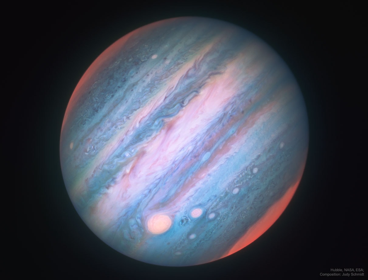 Jupiter looks a bit different in infrared light. To better understand Jupiter's cloud motions and to help NASA's robotic Juno spacecraft understand the planetary context of the small fields that it sees, the Hubble Space Telescope is being directed to regularly image the entire Jovian giant. The colors of Jupiter being monitored go beyond the normal human visual range to include both ultraviolet and infrared light.  Featured here in 2016, three bands of near-infrared light have been digitally reassigned into a mapped color image.  Jupiter appears different in infrared partly because the amount of sunlight reflected back is distinct, giving differing cloud heights and latitudes discrepant brightnesses. Nevertheless, many familiar features on Jupiter remain, including the  light zones and dark belts that circle the planet near the equator, the Great Red Spot on the lower left, and the string-of-pearls storm systems south of the Great Red Spot.  The poles glow because high altitude haze there is energized by charged particles from Jupiter's magnetosphere.  Juno has now completed 10 of 12 planned science orbits of Jupiter and continues to record data that are helping humanity to understand not only Jupiter's weather but what lies beneath Jupiter's thick clouds.
