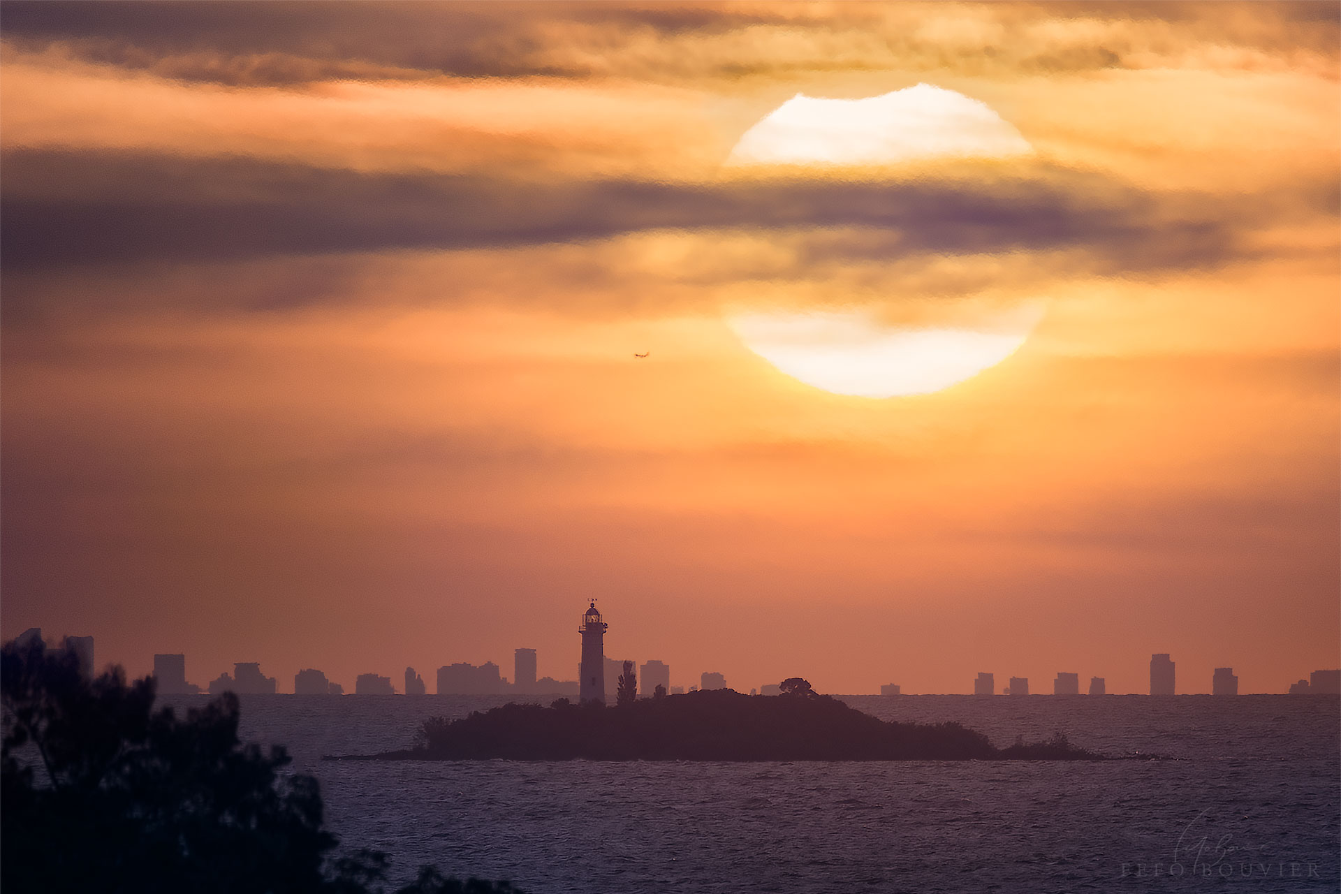 What's happened to top of the Sun? Last week, parts of Earth's southern hemisphere were treated to a partial solar eclipse, where the Moon blocks out part of the Sun. The featured image was taken toward the end of the eclipse from the coast of Uruguay overlooking Argentina's Buenos Aires. Light-house adorned Farall�n Island is seen in the foreground, and a plane is visible just to the left of the Sun.  The image is actually a digital combination of two consecutive exposures taken with the same camera using the same settings -- one taken of the landscape and another of the background Sun. The next solar eclipse visible on Earth will be another partial eclipse occurring in mid-July and visible from parts of southern Australia including Tasmania.
