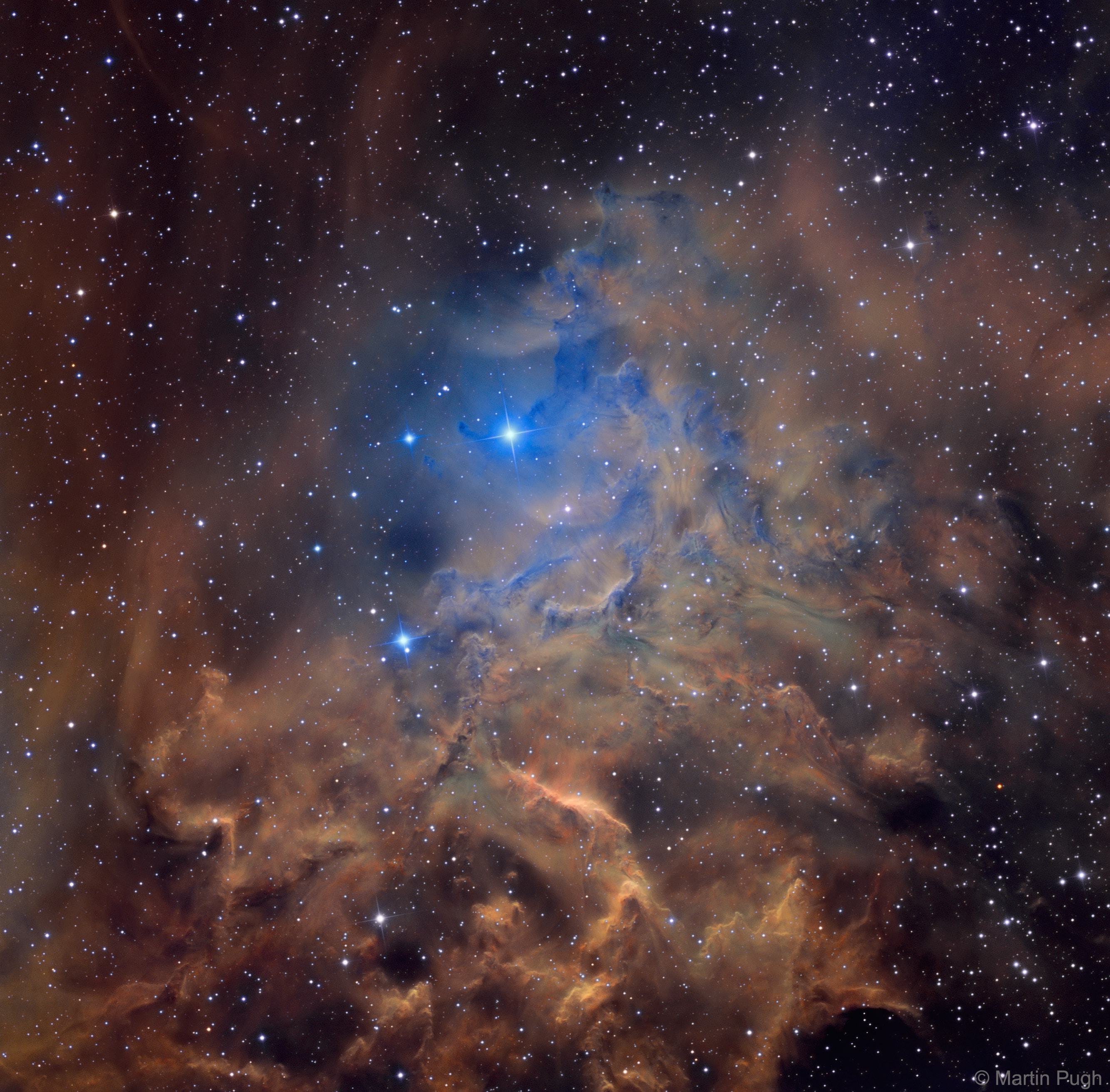 Why is AE Aurigae called the flaming star? For one reason, the surrounding nebula IC 405 is named the Flaming Star Nebula because the region seems to harbor smoke, even though nothing is on fire, including interior star AE Aurigae.  Fire, typically defined as the rapid molecular acquisition of oxygen, happens only when sufficient oxygen is present and is not important in such high-energy, low-oxygen environments. The material that appears as smoke is mostly interstellar hydrogen, but does contain smoke-like dark filaments of carbon-rich dust grains. The bright star AE Aurigae is visible near the nebula center and is so hot it is blue, emitting light so energetic it knocks electrons away from atoms in the surrounding gas. When an atom recaptures an electron, light is emitted creating the surrounding emission nebula. The Flaming Star nebula lies about 1,500 light years distant, spans about 5 light years, and is visible with a small telescope toward the constellation of the Charioteer (Auriga).