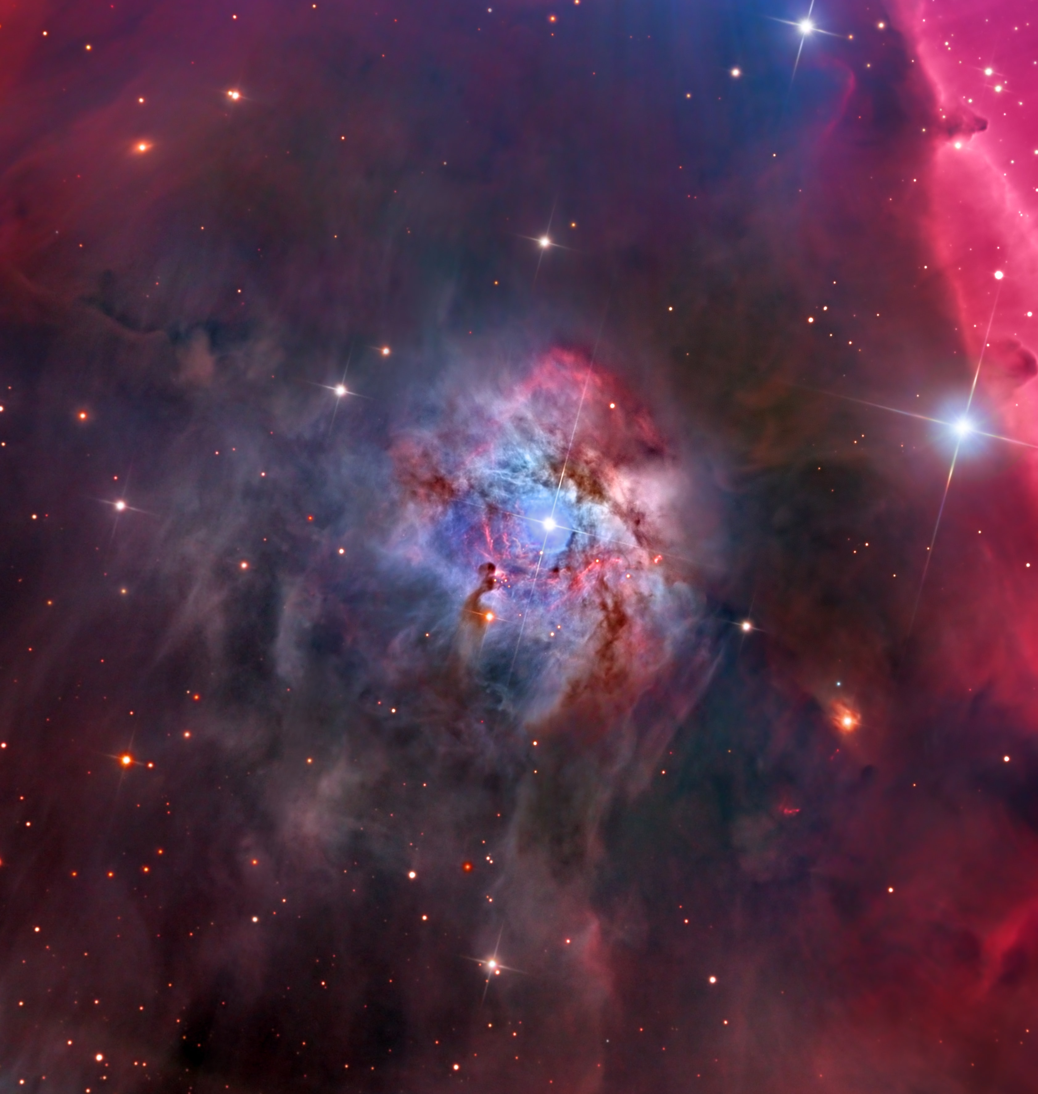 Carved by a bright young star in Orion's dusty molecular clouds, NGC 2023 is often overlooked in favor of the nearby dramatic silhouette of the Horsehead Nebula. In its own right it is seen as a beautiful star forming emission and reflection nebula though, a mere 1500 light-years distant. Surprisingly colorful and complex filaments are detailed in this rare NGC 2023 portrait. Scattered points of emission are also from the region's Herbig-Haro objects, associated with the energetic jets from newborn stars. The sharp telescopic view spans about 10 light-years at the estimated distance of NGC 2023. Off the right edge of the frame lies the more familiar cosmic Horsehead.