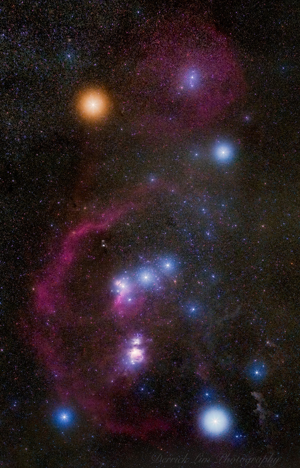 Do you recognize this constellation?  Although it is one of the most recognizable star groupings on the sky, Orion's icons don't look quite as colorful to the eye as they do to a camera.  In this 20-image digitally-composed mosaic, cool red giant Betelgeuse takes on a strong orange tint as the brightest star at the upper left.  Orion's hot blue stars are numerous, with supergiant Rigel balancing Betelgeuse at the lower right, and Bellatrix at the upper right Lined up in Orion's belt are three stars all about 1,500 light-years away, born from the constellation's well-studied interstellar clouds. Below Orion's belt a reddish and fuzzy patch that might also look familiar -- the stellar nursery known as Orion's Nebula.  Finally, just barely visible to the unaided eye but quite striking here by camera is Barnard's Loop -- a huge gaseous emission nebula surrounding Orion's Belt and Nebula discovered over 100 years ago by the pioneering Orion photographer E. E. Barnard.    Follow APOD on: Facebook,  Google Plus,  Instagram, or Twitter