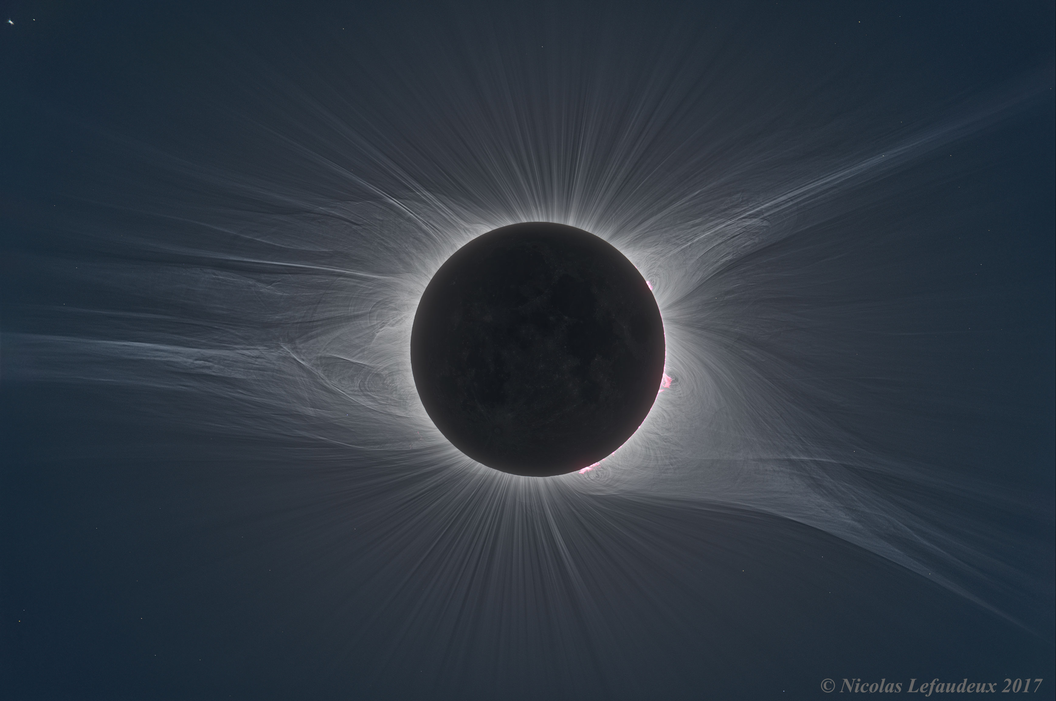 How great was the Great American Eclipse? The featured HDR image shows it to be perhaps greater than we knew. On August 21 of last year, the Moon blocked the Sun for a few minutes along a narrow path across the USA. Although one of the most photographed events in human history, this image -- only recently completed after an extraordinary amount of digital processing -- shows one of the most detailed depictions of a solar corona ever taken.  Composed of extremely hot gas, the solar corona is only visible to the unaided eye during a total solar eclipse. The featured image combined over 70 images of different time exposures.  The series of complementary HDR images recovered enough detail to see motion of the solar corona. The images were taken in Unity, Oregon in the morning to get steady atmospheric seeing conditions. The next total solar eclipse visible on Earth will be in 2019 July, while the next one visible across North America and the USA will occur in 2024 April.