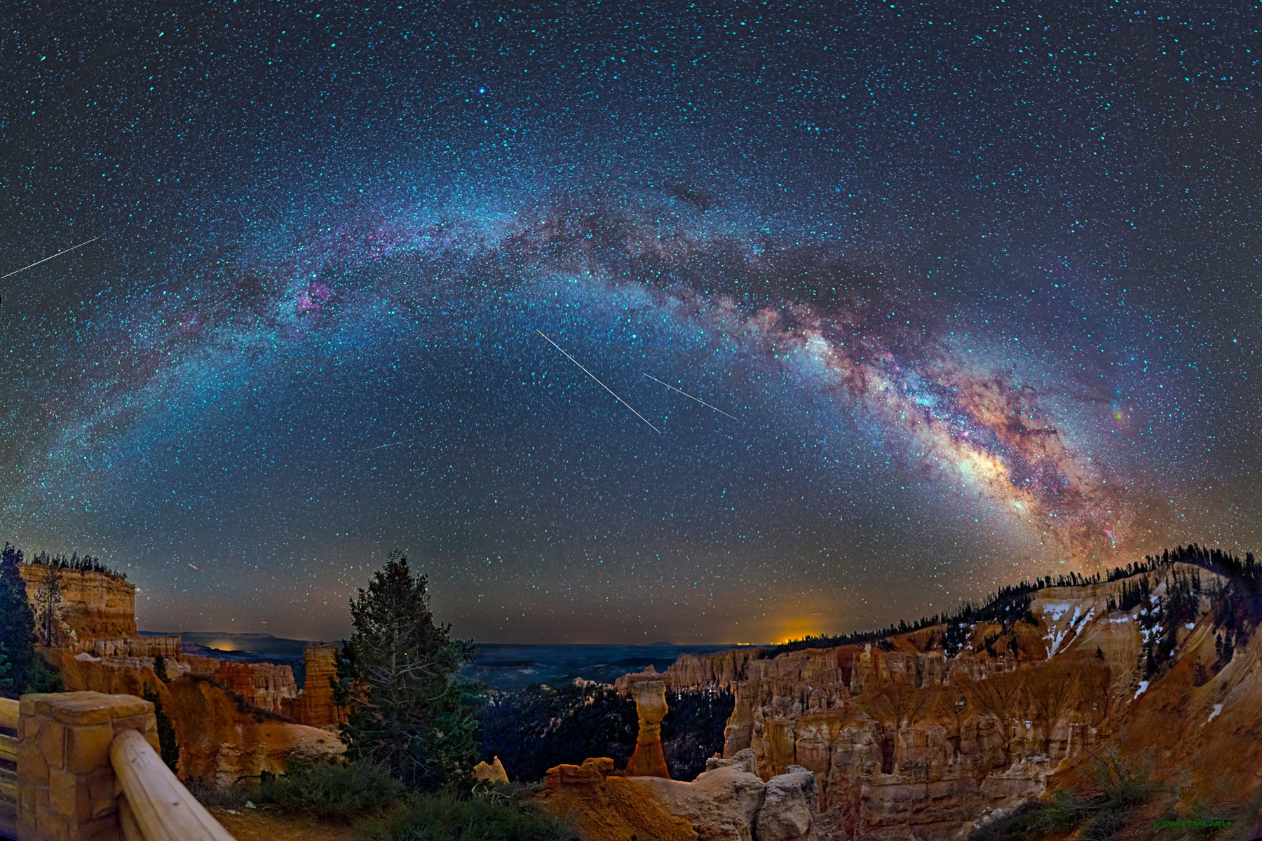 Sometimes land and sky are both busy and beautiful. The landscape pictured in the foreground encompasses Bryce Canyon in Utah, USA, famous for its many interesting rock structures eroded over millions of years. The featured skyscape, photogenic in its own right, encompasses the arching central disk of our Milky Way Galaxy, the short streaks of three passing planes near the horizon, at least four long streaks that are likely Eta Aquariid meteors, and many stars including the three bright stars that make up the Summer Triangle. The featured image is a digital panorama created from 12 smaller images during this date in 2014. Recurring every year, yesterday and tonight mark the peak of this year's Eta Aquriids meteor shower, where a patient observer with dark skies and dark-adapted eyes might expect to see a meteor every few minutes.