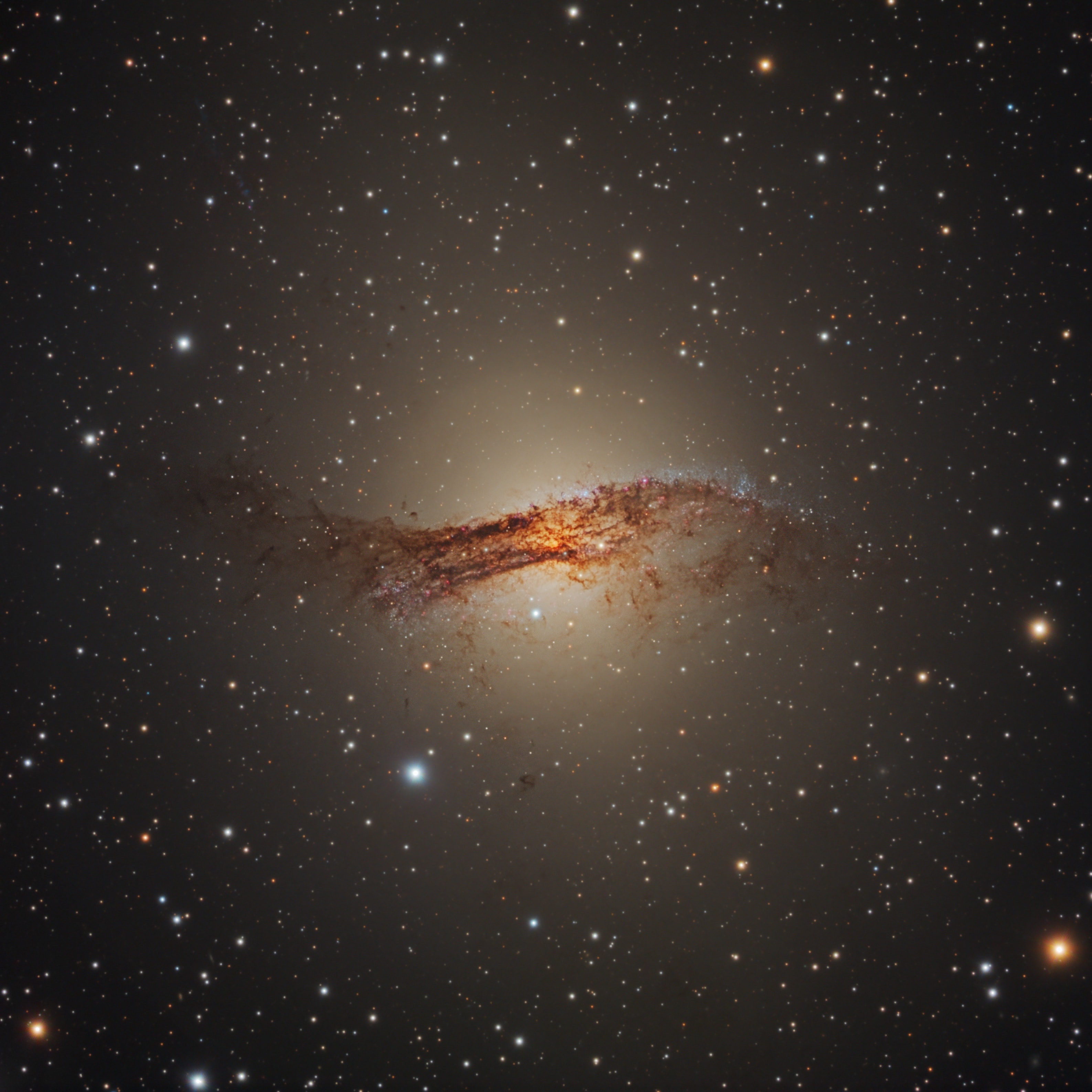 Only 11 million light-years away, Centaurus A is the closest active galaxy to planet Earth. Spanning over 60,000 light-years, the peculiar elliptical galaxy also known as NGC 5128, is featured in this sharp telescopic view. Centaurus A is apparently the result of a collision of two otherwise normal galaxies resulting in a fantastic jumble of star clusters and imposing dark dust lanes. Near the galaxy's center, left over cosmic debris is steadily being consumed by a central black hole with a billion times the mass of the Sun. As in other active galaxies, that process likely generates the radio, X-ray, and gamma-ray energy radiated by Centaurus A.