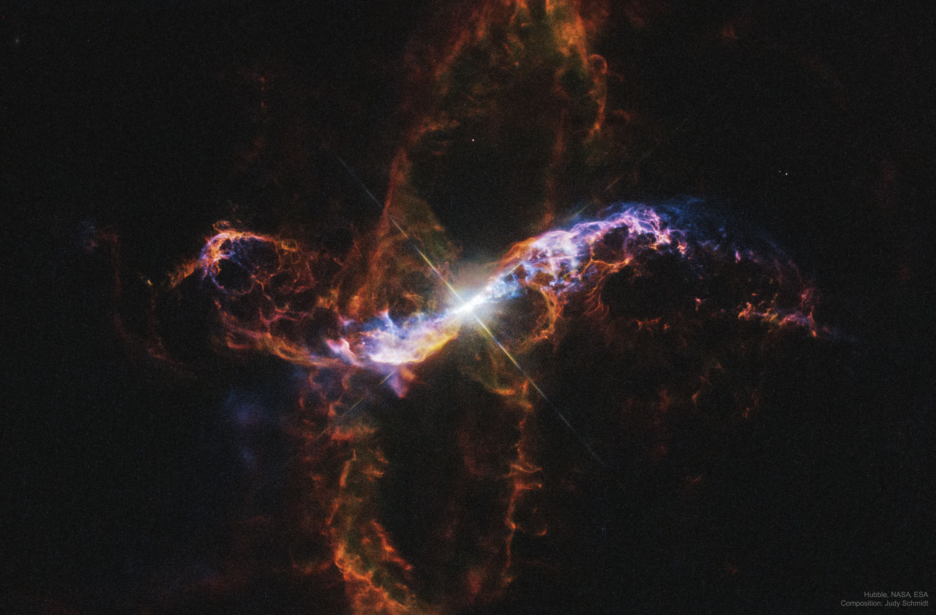 You can see it change in brightness with just binoculars over the course of a year. Variable star R Aquarii is actually an interacting binary star system, two stars that seem to have a close, symbiotic relationship. About 710 light years away, this intriguing system consists of a cool red giant star and hot, dense white dwarf star in mutual orbit around their common center of mass. The binary system's visible light is dominated by the red giant, itself a Mira-type long period variable star. But material in the cool giant star's extended envelope is pulled by gravity onto the surface of the smaller, denser white dwarf, eventually triggering a thermonuclear explosion and blasting material into space. The featured image from the Hubble Space Telescope shows the still-expanding ring of debris which spans less than a light year and originated from a blast that would have been seen in the early 1770s. The evolution of less understood energetic events producing high energy emission in the R Aquarii system has been monitored since 2000 using Chandra X-ray Observatory data.