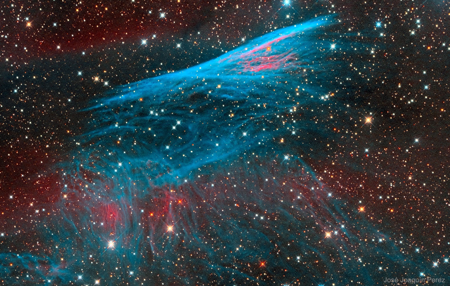 This shock wave plows through interstellar space at over 500,000 kilometers per hour.  Near the top and moving up in this sharply detailed color composite, thin, bright, braided filaments are actually long ripples in a cosmic sheet of glowing gas seen almost edge-on. Cataloged as NGC 2736, its elongated appearance suggests its popular name, the Pencil Nebula. The Pencil Nebula is about 5 light-years long and 800 light-years away, but represents only a small part of the Vela supernova remnant. The Vela remnant itself is around 100 light-years in diameter, the expanding debris cloud of a star that was seen to explode about 11,000 years ago. Initially, the shock wave was moving at millions of kilometers per hour but has slowed considerably, sweeping up surrounding interstellar material. In the featured narrow-band, wide field image, red and blue colors track the characteristic glow of ionized hydrogen and oxygen atoms, respectively.   Growing Galleries: Launch of the Parker Solar Probe and Perseid Meteor Shower 2018