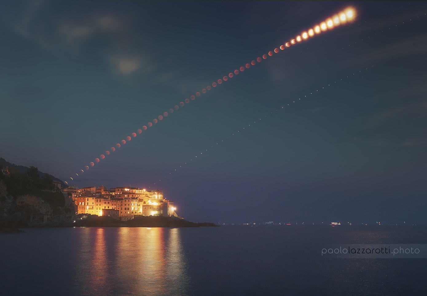 The total phase of the July 27 lunar eclipse lasted for an impressive 103 minutes. That makes it the longest total lunar eclipse of the 21st century. The Moon passed through the center of Earth's shadow while the Moon was near apogee, the most distant point in its elliptical orbit. From start to finish, the entire duration of totality is covered in this composite view. A dreamlike scene, it includes a sequence of digital camera exposures made every three minutes. The exposures track the totally eclipsed lunar disk, accompanied on that night by bright planet Mars, as it climbs above the seaside village of Tellaro, Italy. In the foreground lies the calm mediteranean Gulf of La Spezia,  known to some as the Gulf of Poets. In the 3rd century BCE, heliocentric astronomer Aristarchus also tracked the duration of lunar eclipses, though without the benefit of digital clocks and cameras. Using geometry he devised a way to calculate the Moon's distance from the eclipse duration, in terms of the radius of planet Earth.