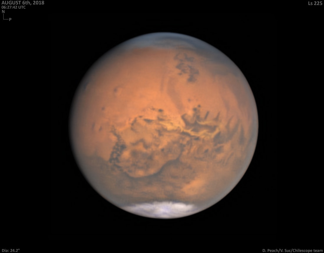 Still bright in evening skies, Mars was just past opposition and closest to Earth on July 31, a mere 57.6 million kilometers away. Captured only a week later, this remarkable image shows the Red Planet's disk near its maximum size in earthbound telescopes, but still less than 1/74th the apparent diameter of a Full Moon. Broad regional surface shadings are starting to reappear in the tantalizing view as the latest planet-wide dust storm subsides. With the bright south polar cap at the bottom, the Valles Marineris extends along the center of the disk. Just below it lies the roughly circular Solis Lacus region sometimes known as the Eye of Mars. In a line, three prominent dark spots left of center are the volcanic Tharsis Montes.