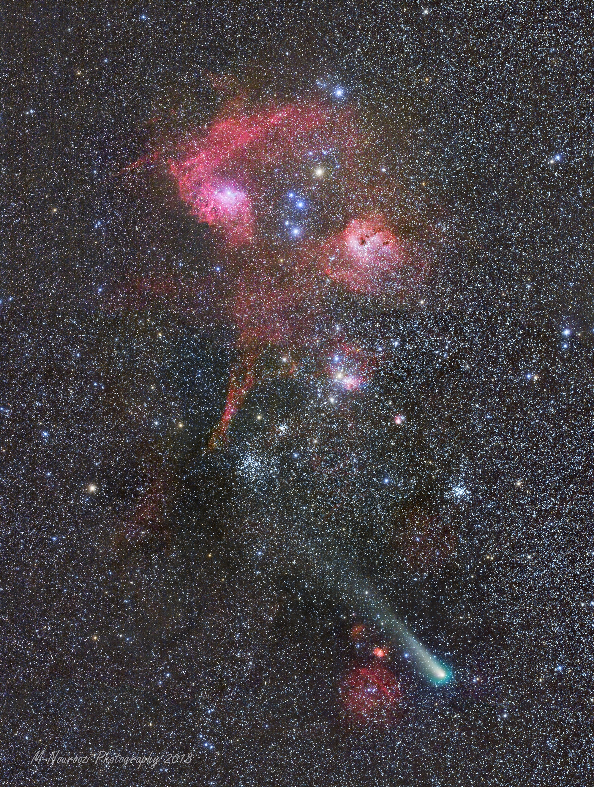 Bright enough for binocular viewing Comet 21P / Giacobini-Zinner stands out, even in this deep telephoto mosaic of the star cluster and nebula rich constellation Auriga the Charioteer. On the night of September 9 its greenish coma and diffuse tail contrast with the colorful stars and reddish emission nebulae in the almost 10 degree field of view along the Milky Way. The comet was near its perihelion and closest approach to Earth, about 200 light-seconds away. Riding across the distant background just above the comet's tail are well-known Auriga star clusters M38 (left of center) and M36 (toward the right) about 4,000 light-years away. At the top left, emission region IC 405 is only 1,500 light-years distant, more dramatically known as the Flaming Star Nebula. To its right lies IC 410, 12,000 light-years away and famous for its star-forming cosmic tadpoles. A child of our Solar System Giacobini-Zinner is a periodic comet orbiting the Sun once every 6.5 years, and the parent body of October's Draconids meteor shower.