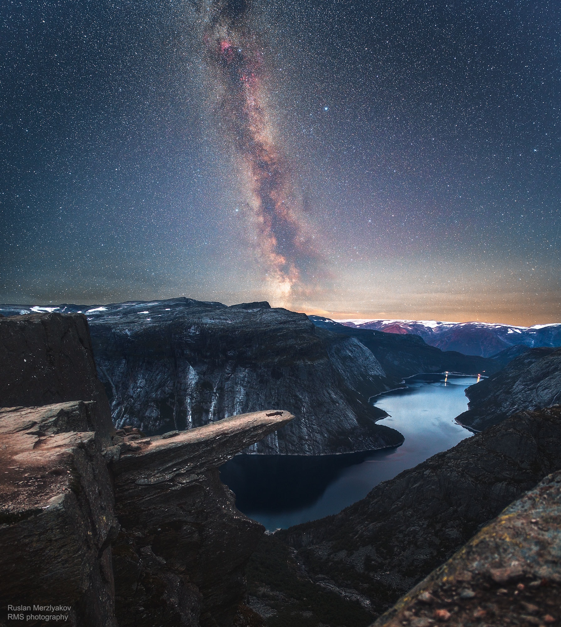 You have to take a long hike to see the Troll's Tongue -- ten hours over rocky terrain. And in this case, it took three trips to capture the landform below a clear night sky.  Trolltunga itself is a picturesque rock protrusion extending about 700 meters over mountainous cliffs near Lake Ringedalsvatnet in Norway.  The overhang is made of billion-year-old Precambrian bedrock that was carved out by glaciers during an ice-age about 10,000 years ago.  The featured picture is a composite of two exposures, a 15-second image of the foreground Earth followed 40 minutes later by an 87-second exposure of the background sky.  Thousands of discernable stars dot the backdrop starscape in addition to billions of unresolved stars in the nearly vertical band of our Milky Way Galaxy.