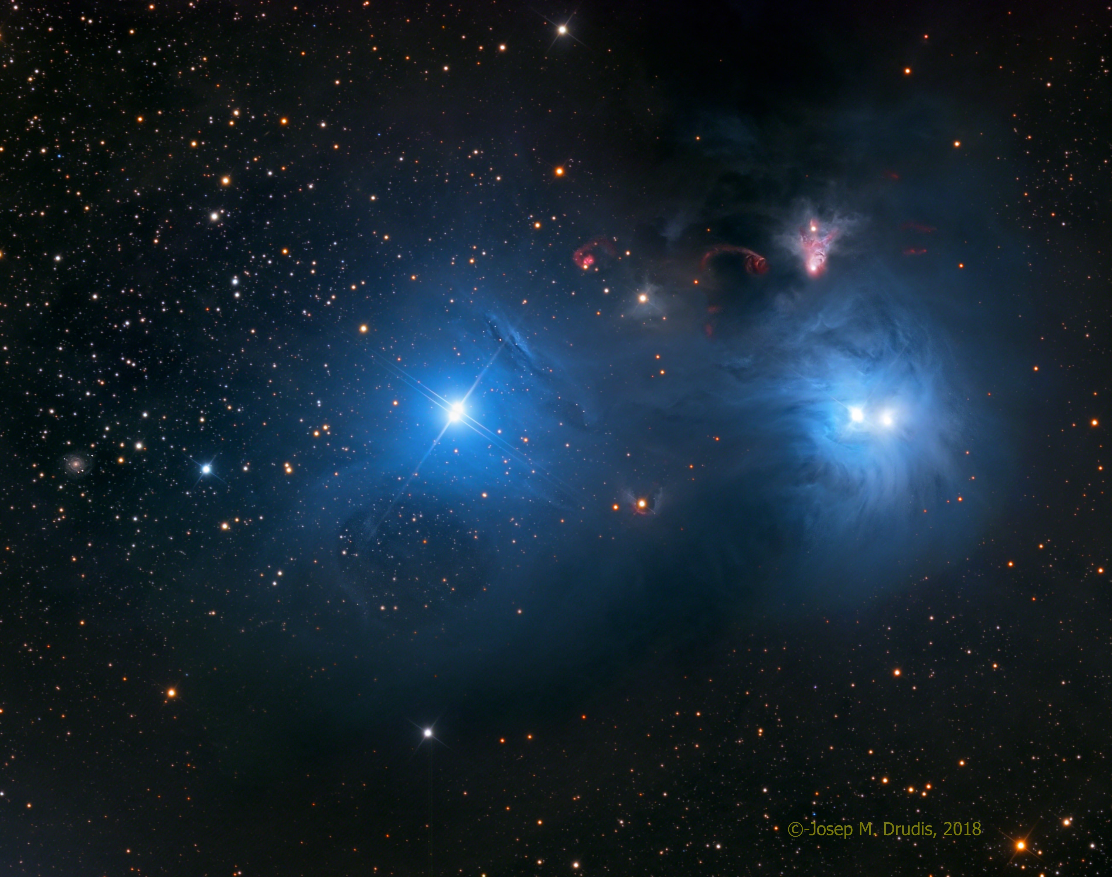 Cosmic dust clouds and young, energetic stars inhabit this telescopic vista, less than 500 light-years away toward the northern boundary of Corona Australis, the Southern Crown. The dust clouds effectively block light from more distant background stars in the Milky Way. But the striking complex of reflection nebulae cataloged as NGC 6726, 6727, and IC 4812 produce a characteristic color as blue light from the region's young, hot stars is reflected by the cosmic dust. The dust also obscures from view stars still in the process of formation. At top right, smaller yellowish nebula NGC 6729 bends around young variable star R Coronae Australis. Near it, glowing arcs and loops shocked by outflows from embedded newborn stars are identified as Herbig-Haro objects. On the sky this field of view spans about 1 degree. That corresponds to almost 9 light-years at the estimated distance of the nearby star forming region.