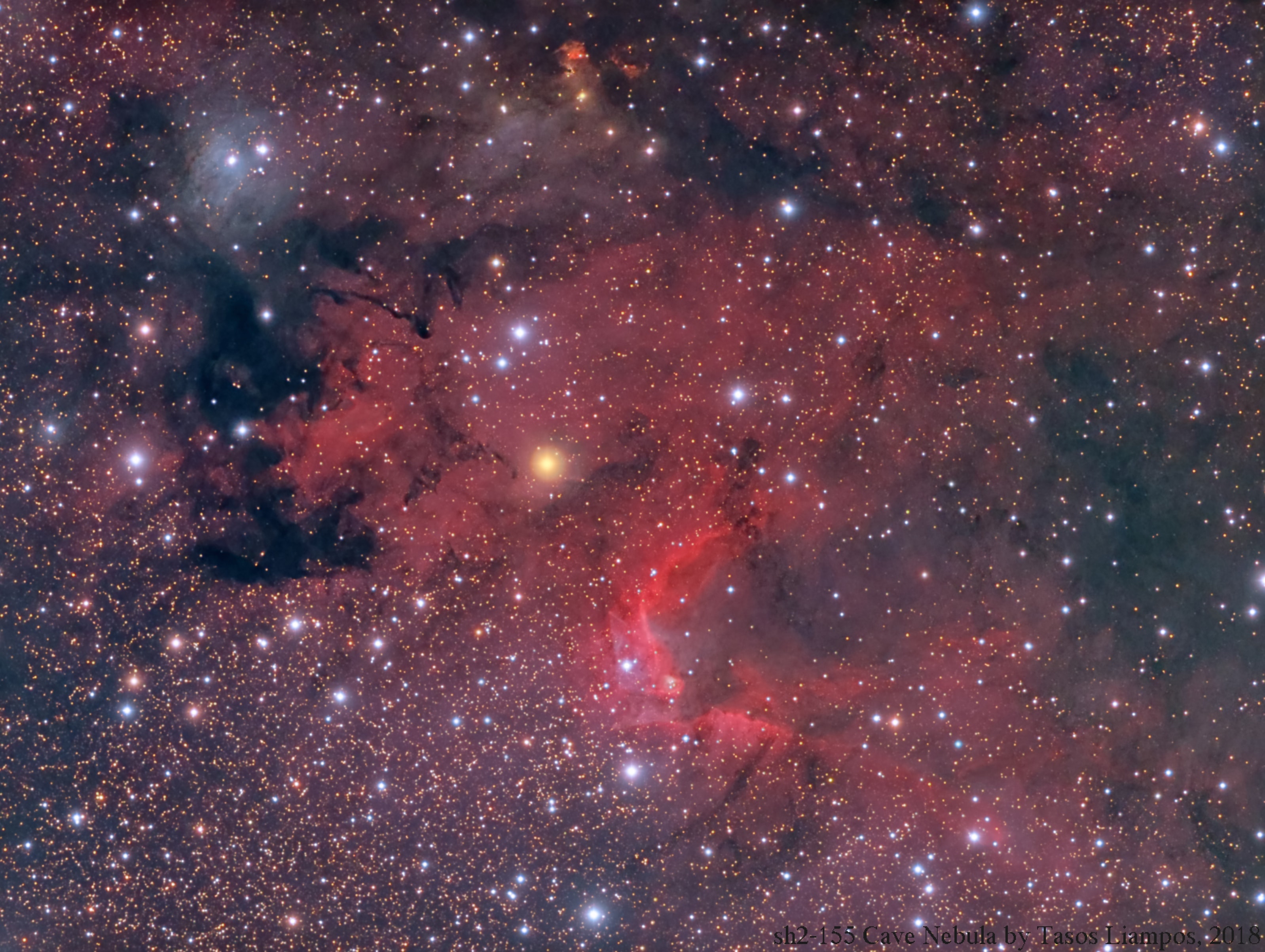 This colorful skyscape spans about two full moons across nebula rich starfields along the plane of our Milky Way Galaxy in the royal northern constellation Cepheus. Near the edge of the region's massive molecular cloud some 2,400 light-years away, bright reddish emission region Sharpless (Sh) 155 is below and right of center, also known as the Cave Nebula. About 10 light-years across the cosmic cave's bright walls of gas are ionized by ultraviolet light from the hot young stars around it. Dusty blue reflection nebulae, like vdB 155 at upper left, and dense obscuring clouds of dust also abound on the interstellar canvas. Astronomical explorations have revealed other dramatic signs of star formation, including the bright red fleck of Herbig-Haro (HH) 168. Near top center in the frame, the Herbig-Haro object emission is generated by energetic jets from a newborn star.
