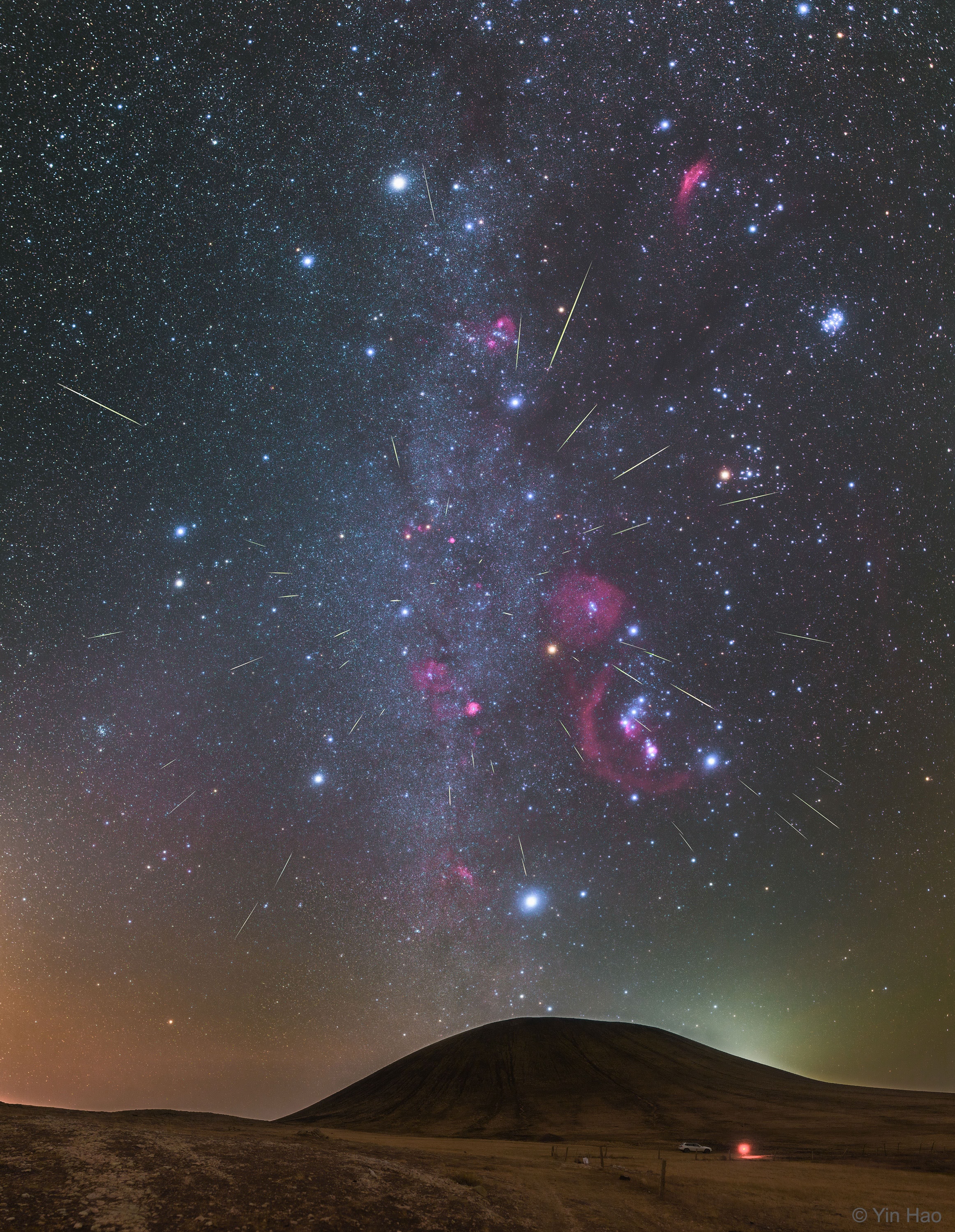 Meteors have been shooting out from the constellation of Orion.  This was expected, as October is the time of year for the Orionids Meteor Shower.  Pictured here, over two dozen meteors were caught in successively added exposures last October over Wulan Hada volcano in Inner Mongolia, China. The featured image shows multiple meteor streaks that can all be connected to a single small region on the sky called the radiant, here visible just above and to the left of the belt of Orion,  The Orionids meteors started as sand sized bits expelled from Comet Halley during one of its trips to the inner Solar System.  Comet Halley is actually responsible for two known meteor showers, the other known as the Eta Aquarids and visible every May.  An Orionids image featured on APOD one year ago today from the same location shows the same car.  Next month, the Leonids Meteor Shower from Comet Tempel-Tuttle should also result in some bright meteor streaks.   Follow APOD on: Facebook,  Instagram, Reddit, or Twitter