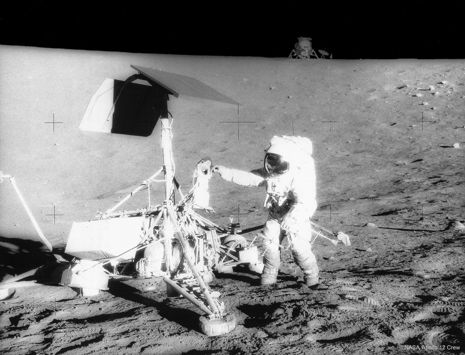 Apollo 12 was the second mission to land humans on the Moon. The landing site was picked to be near the location of Surveyor 3, a robot spacecraft that had landed on the Moon three years earlier. In the featured photograph, taken by lunar module pilot Alan Bean, mission commander Pete Conrad jiggles the Surveyor spacecraft to see how firmly it is situated. The lunar module is visible in the distance.  Apollo 12 brought back many photographs and moon rocks.  Among the milestones achieved by Apollo 12 was the deployment of the Apollo Lunar Surface Experiments Package, which carried out many experiments including one that measured the solar wind.